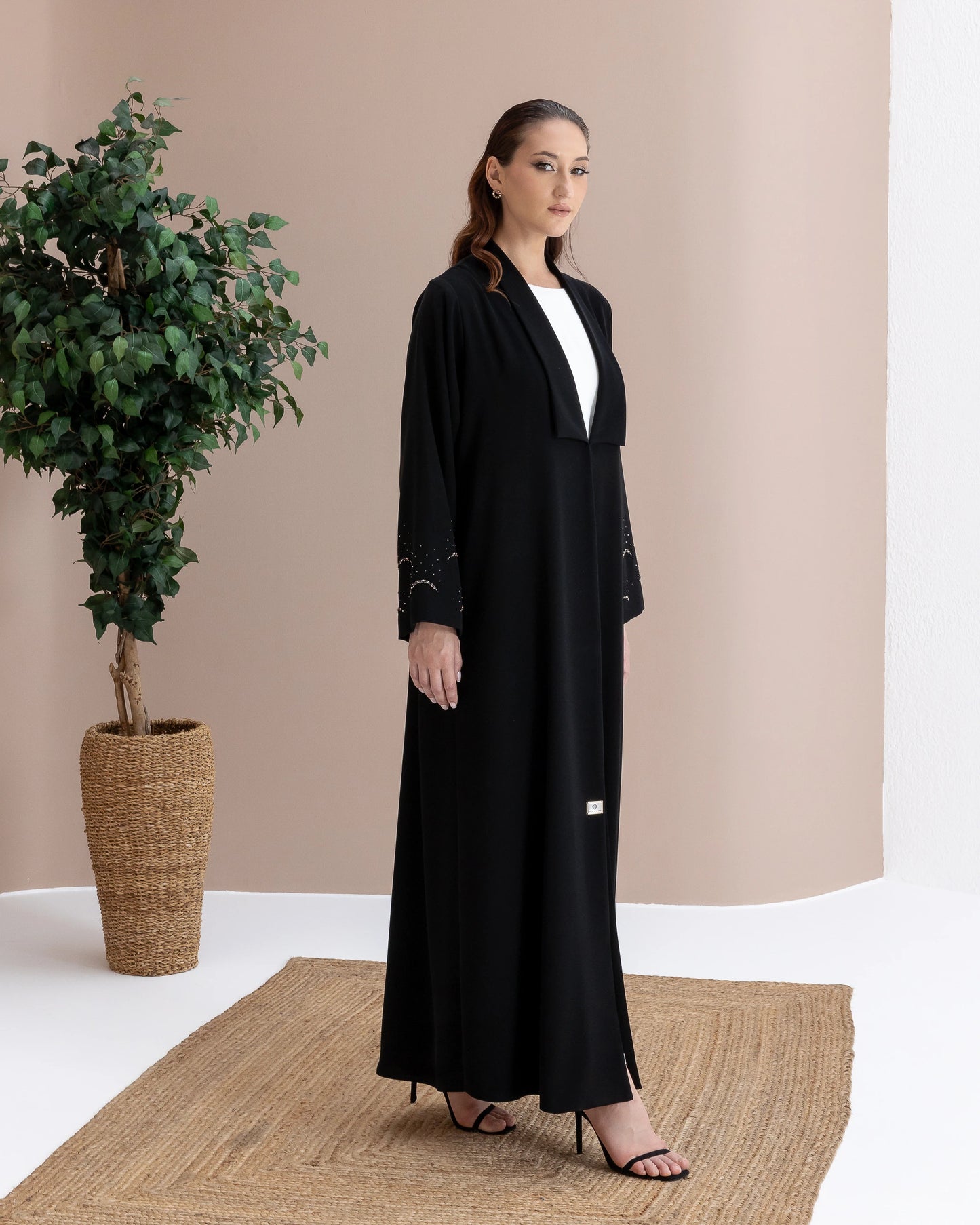 MAHNUR Noir Halo side-view designer abaya with graceful drape and understated evening luxury