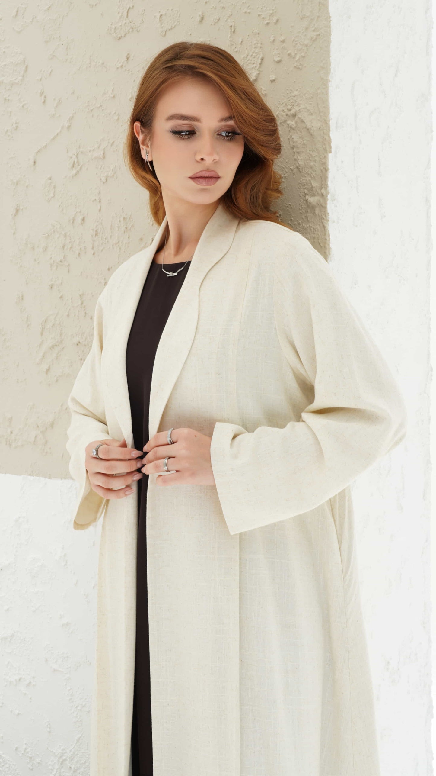 Naima ivory abaya with structured lapel and minimal luxury silhouette