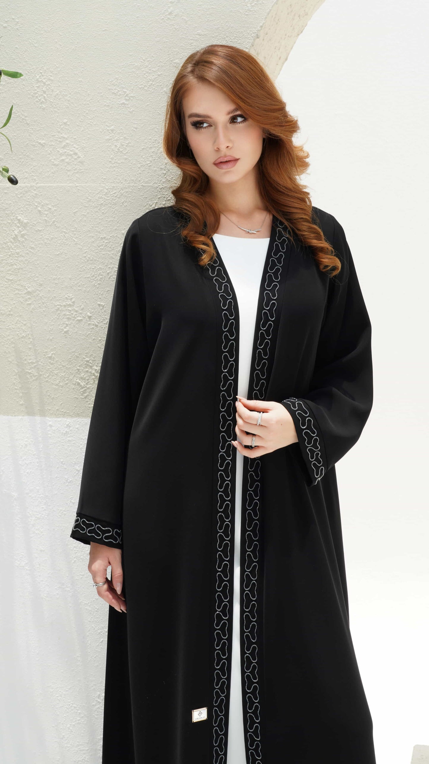 TAHIRA | Noir Ligne black abaya close up front panel silver bead detailing