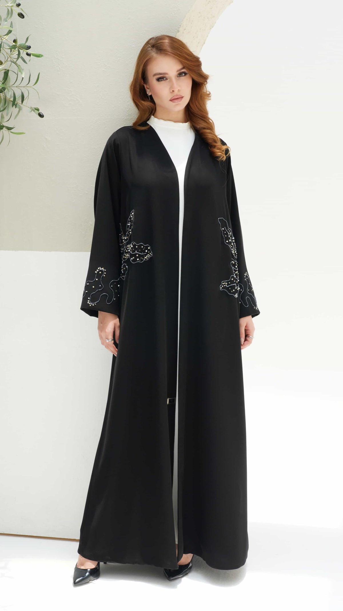 AZIZA | Noir Fleur Full length black abaya with elegant floral embellishments and fluid silhouette