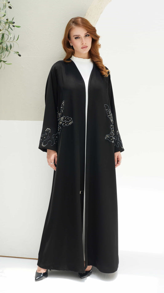 AZIZA | Noir Fleur Full length black abaya with elegant floral embellishments and fluid silhouette