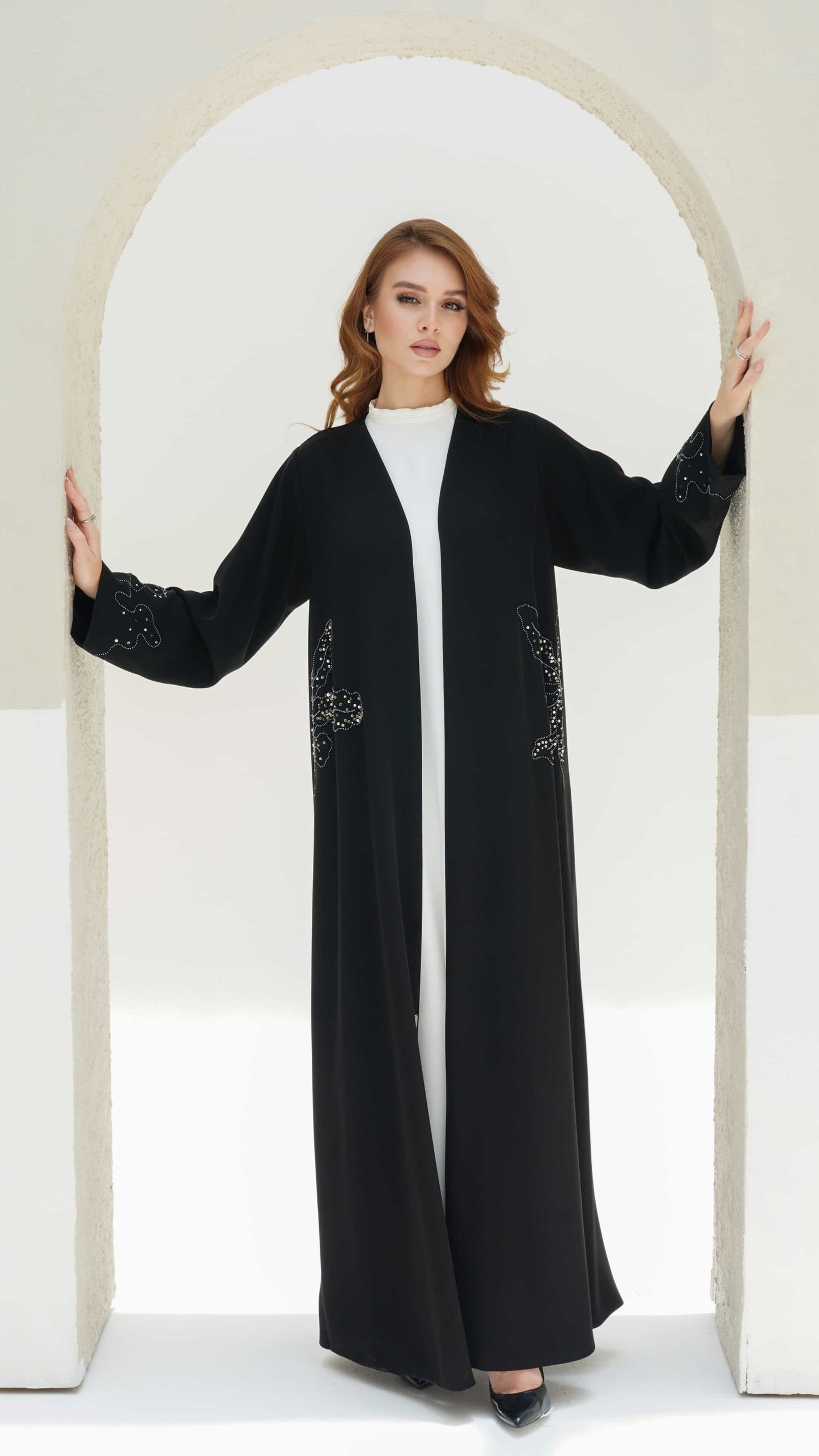 Aziza Noir Fleur black luxury abaya with silver floral beadwork on sleeves