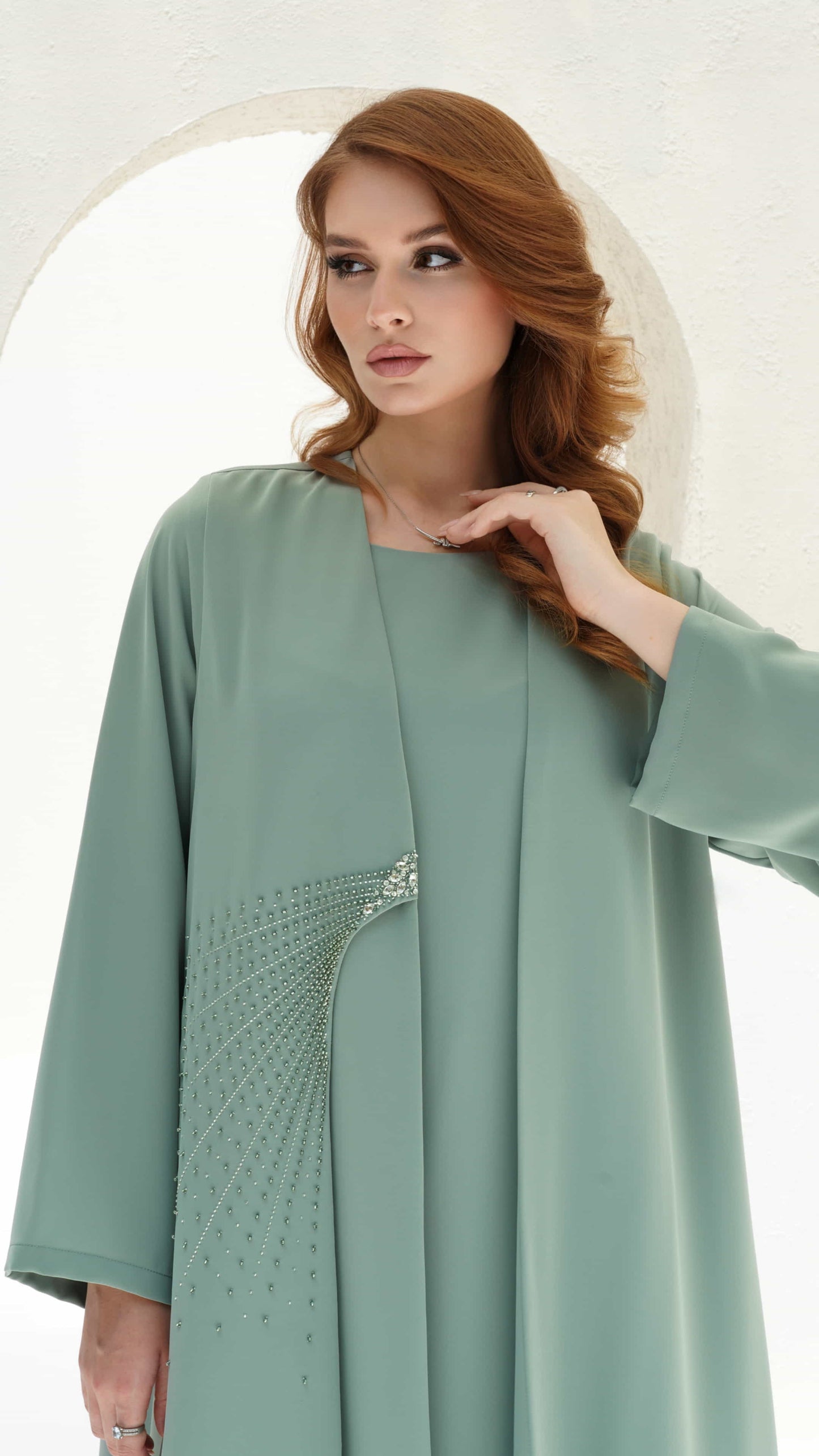 BAHIA | Sage Radiance Close up crystal detailing in fan pattern on abaya waist