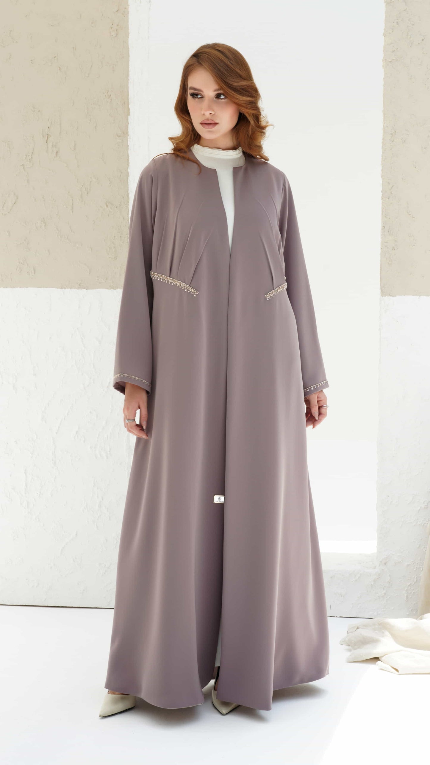 DOUNIA | Blush Aura Elegant pastel abaya with subtle pleats and refined feminine silhouette