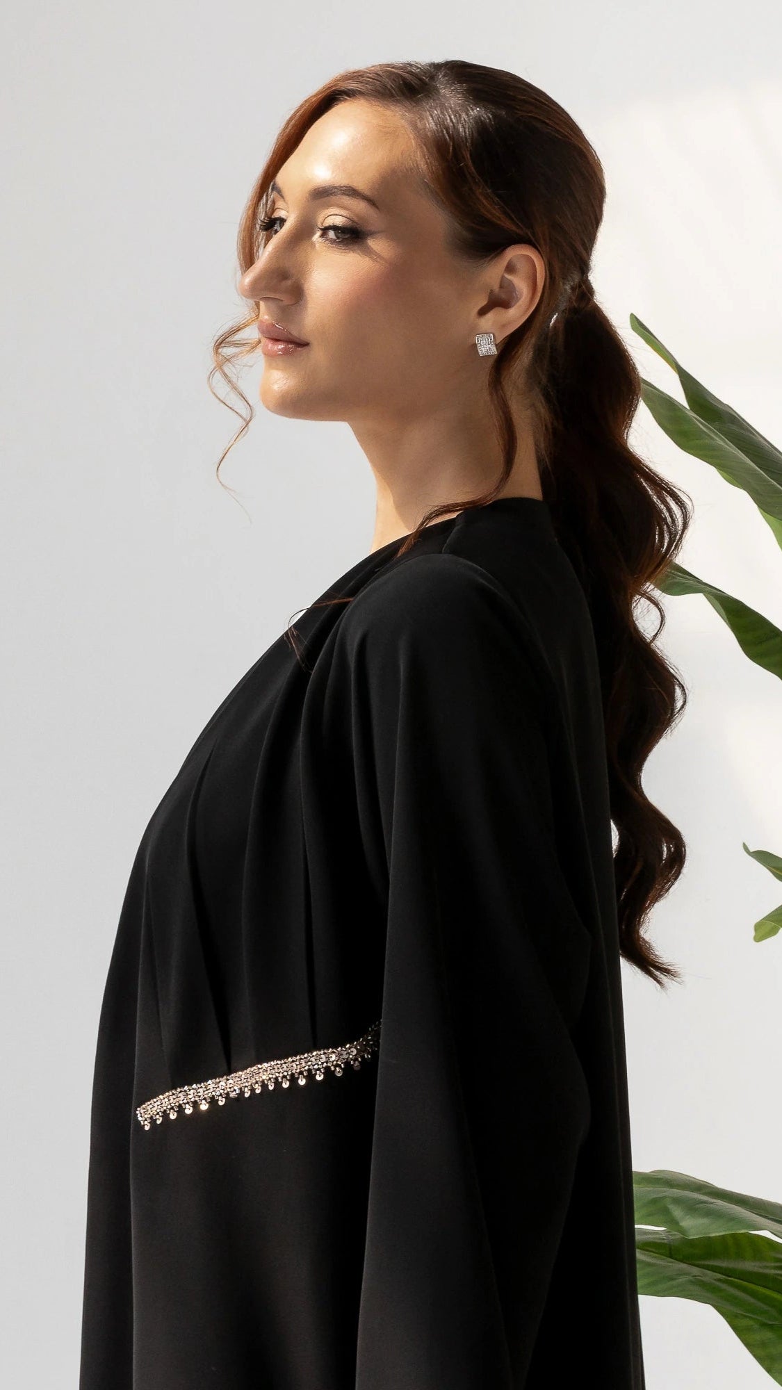 DOUNIA Noir Lumiere Modern modest luxury abaya in black with delicate crystal pocket detailing for elegant evening wear