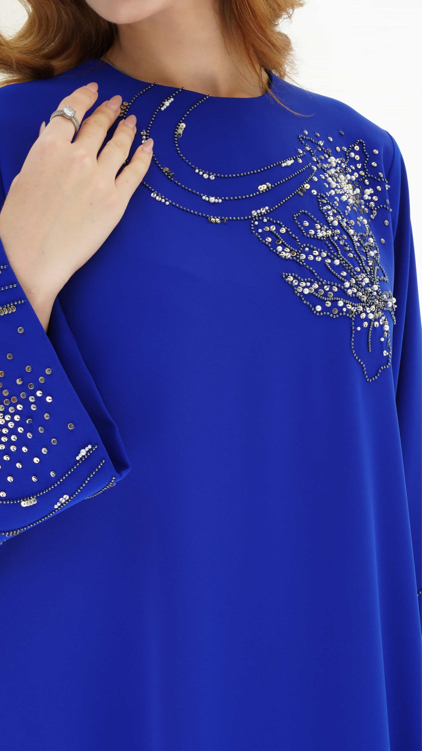 ELINA | Celestial Sapphire Close up of crystal constellation embellishment on blue kaftan
