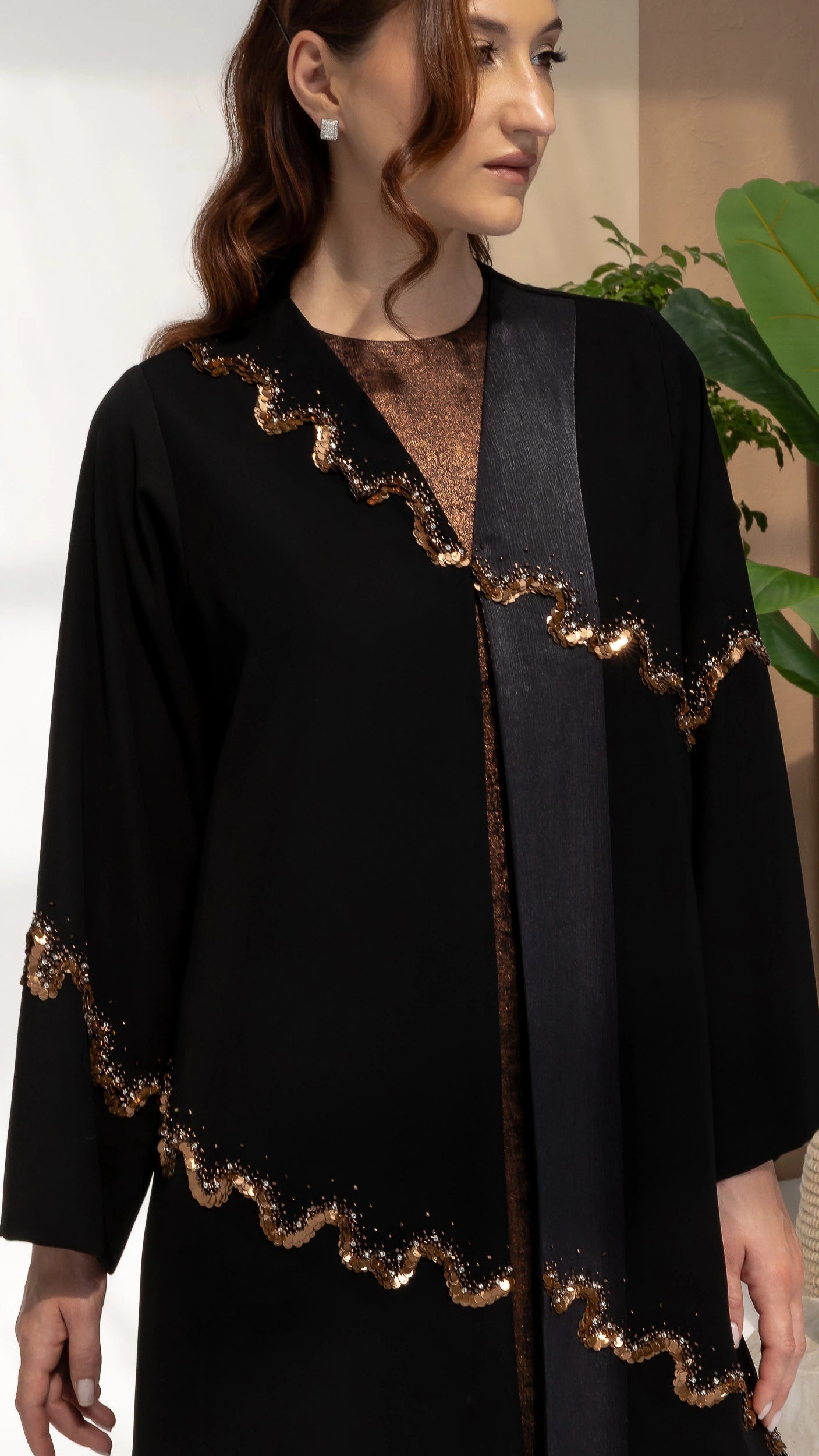 Portrait close-up of GHALA Copper Luxe abaya showcasing sophisticated copper shimmer detailing