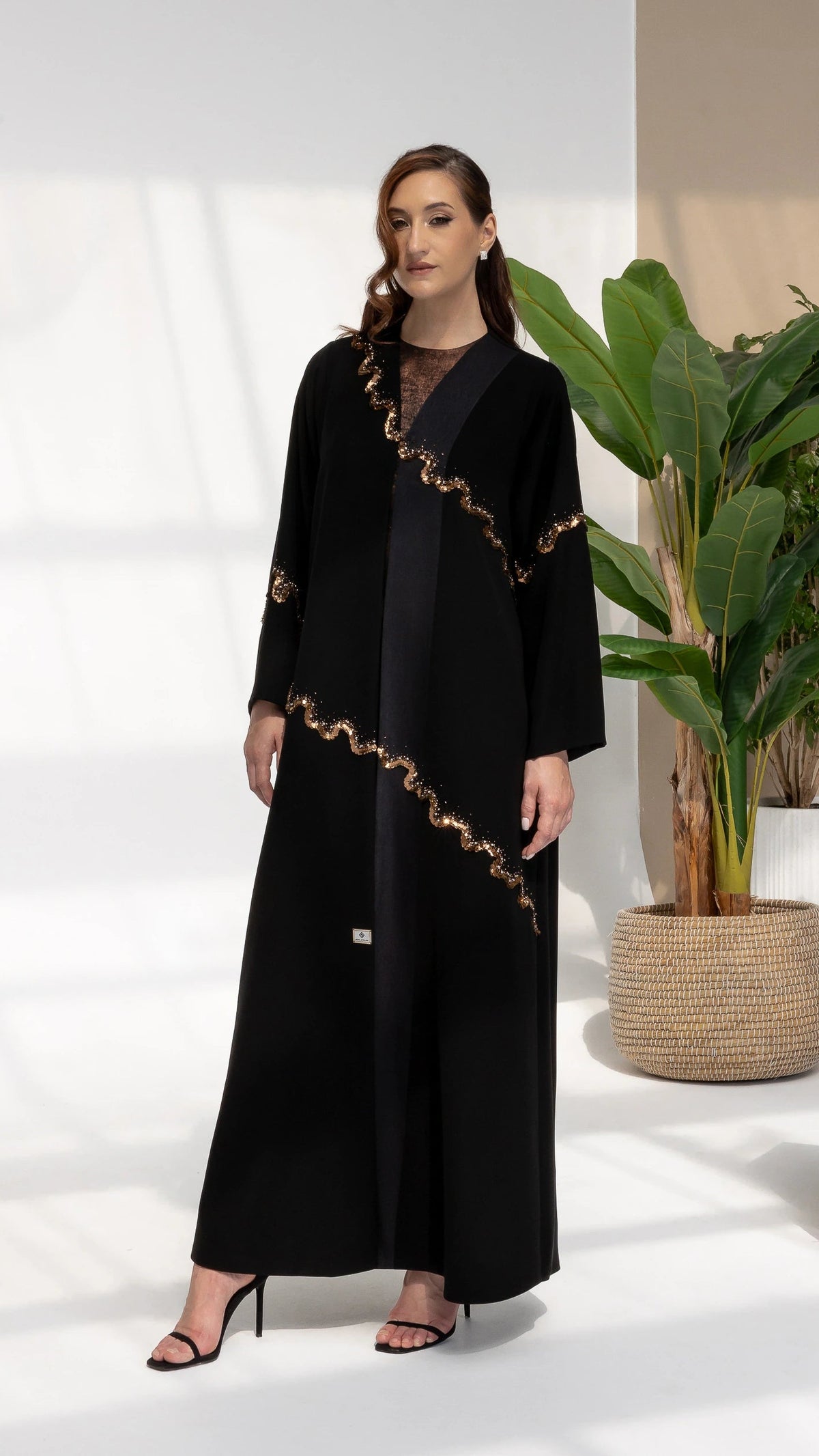 GHALA Copper Luxe - Elegant full-length black abaya with radiant copper wave detailing for Eid and evening wear