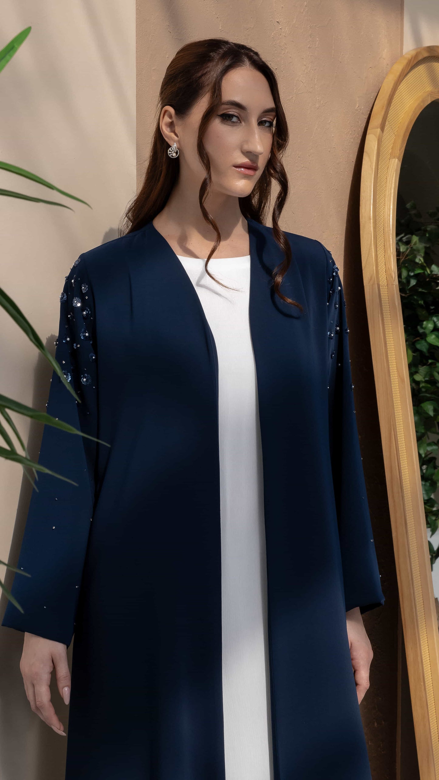 HANA | Sapphire Petal Bloom Navy blue abaya shoulder detailing with pearl floral accents close-up