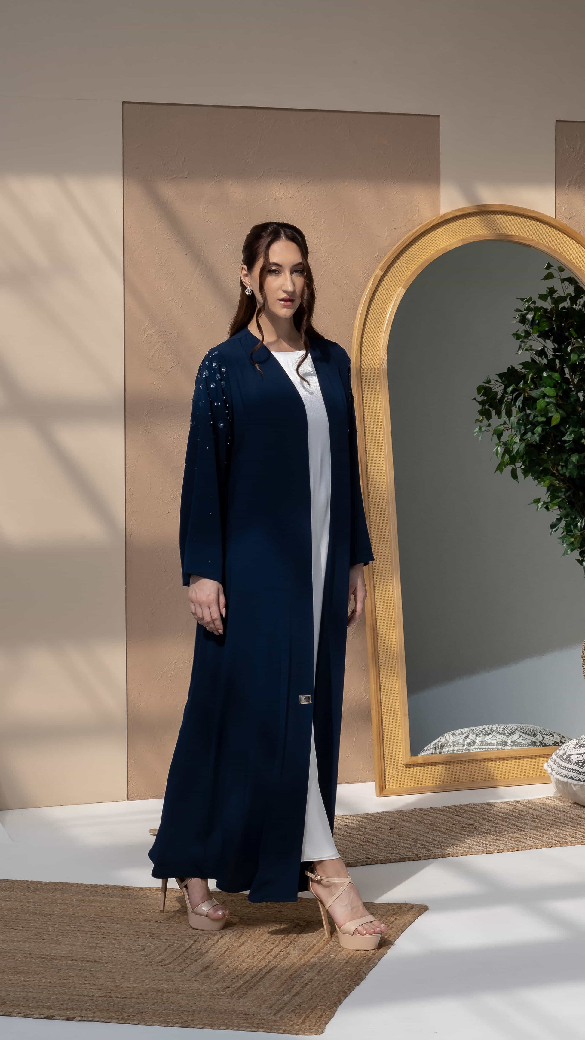 HANA | Sapphire Petal Bloom Side profile of navy abaya showcasing elegant drape and movement