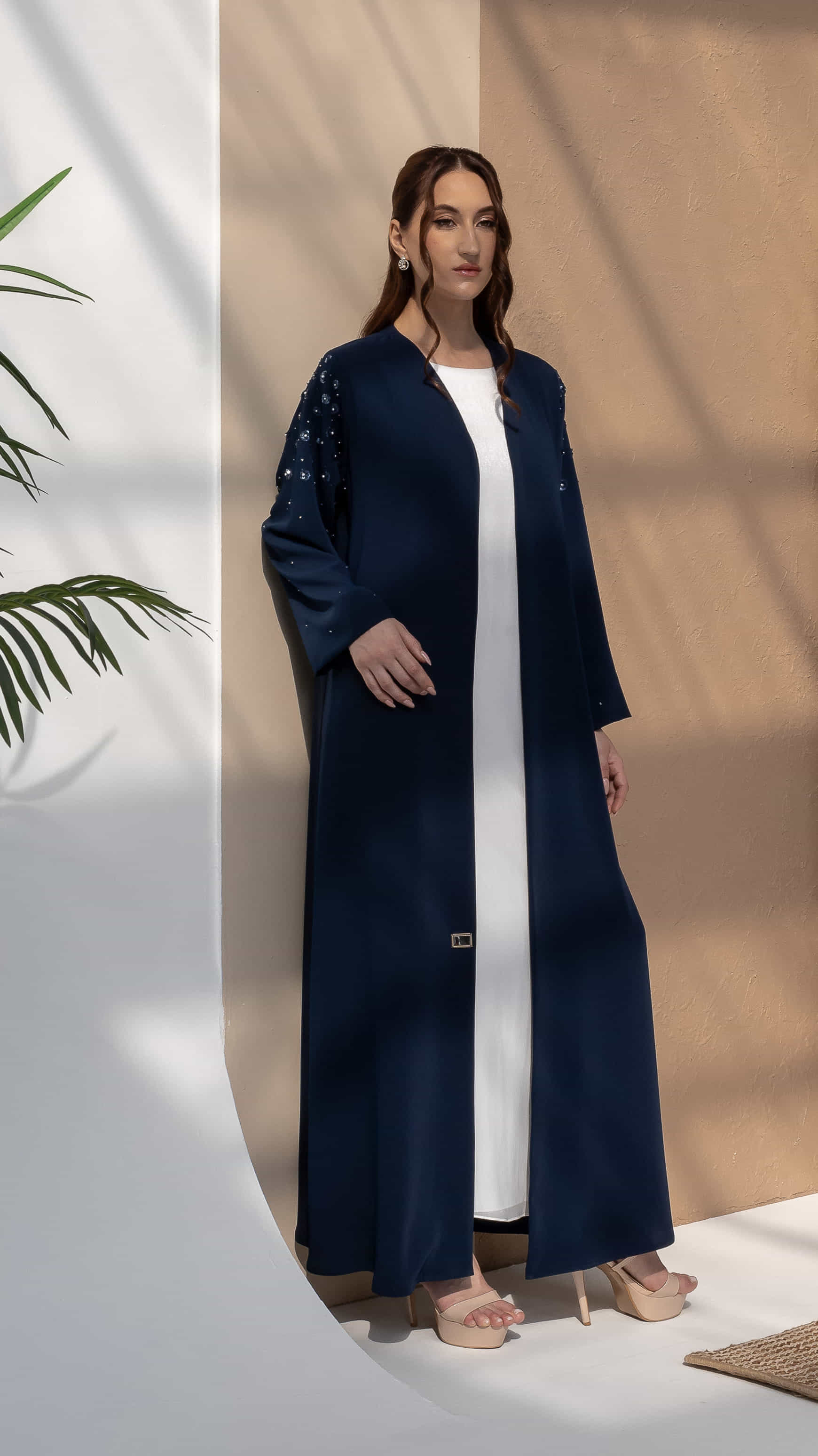HANA_Sapphire_Petal_Bloom_Standing Elegant sapphire abaya flowing silhouette studio setting