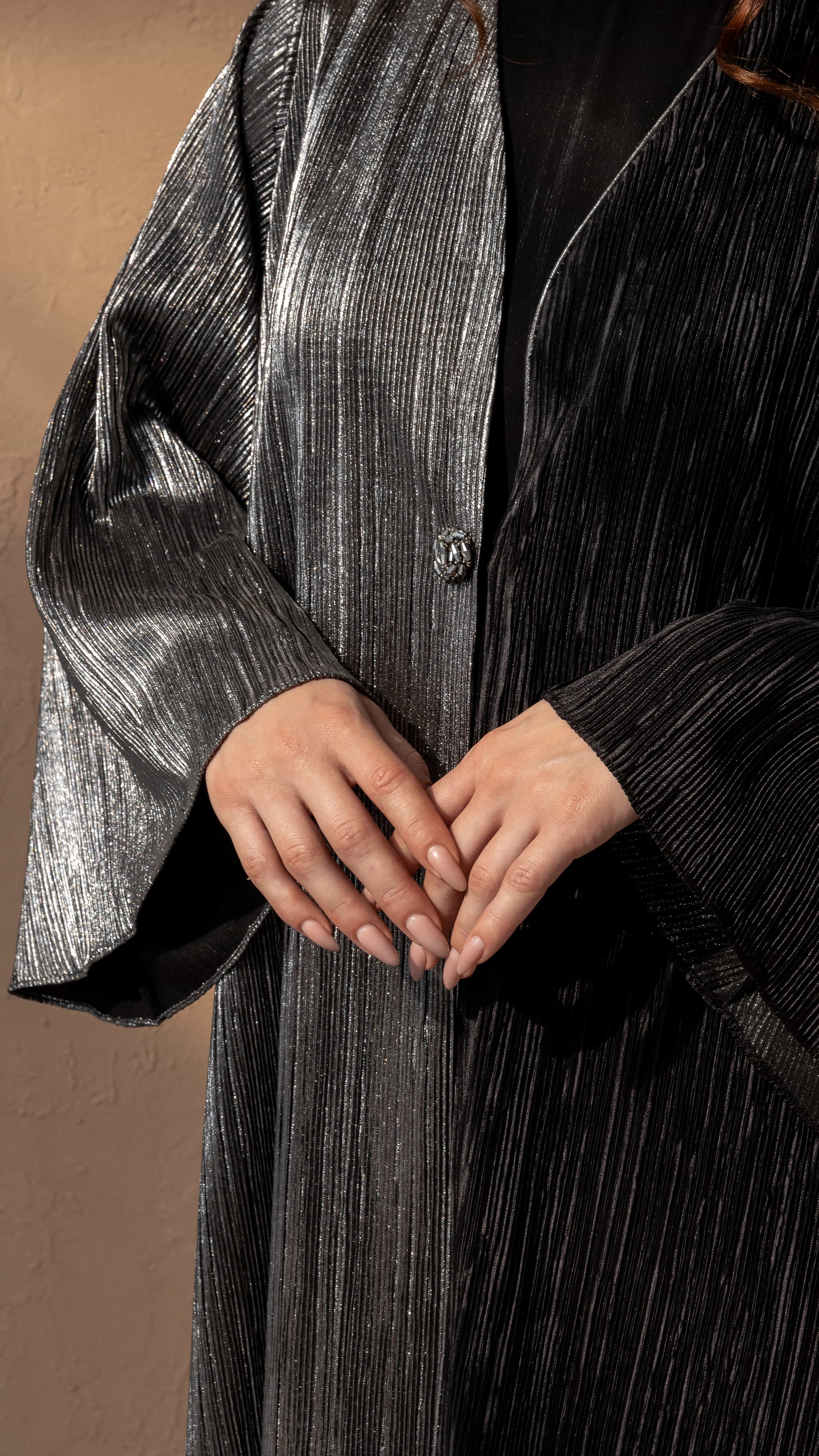 HIND | Noir Argent Luxe close up ribbed fabric texture with silver sheen on HIND abaya