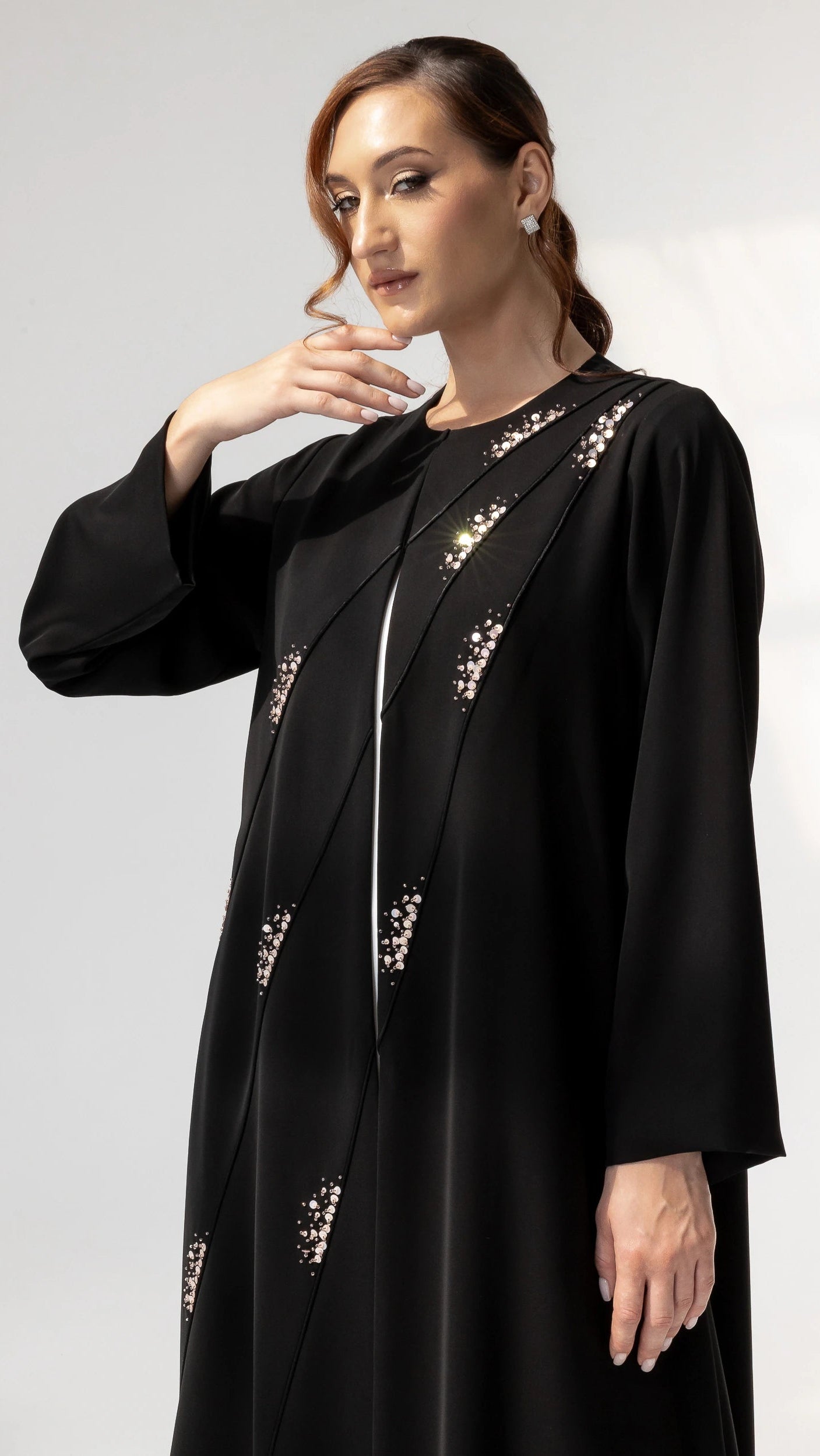 Editorial portrait of JAWA Noir Constelle luxury abaya with modern modest elegance