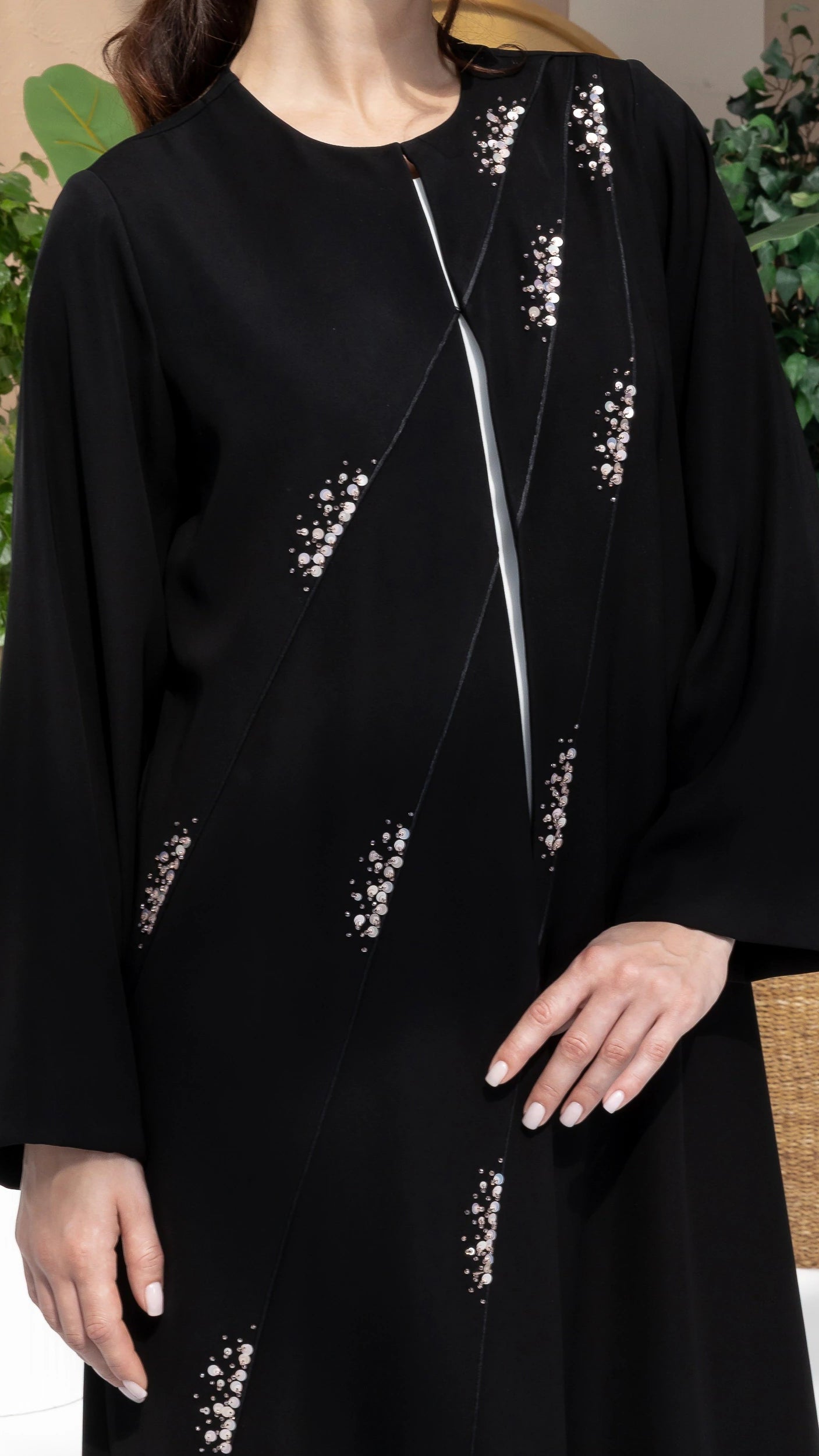 JAWA Noir Constelle Elegant black couture abaya featuring sculpted panel lines and crystal embellishments