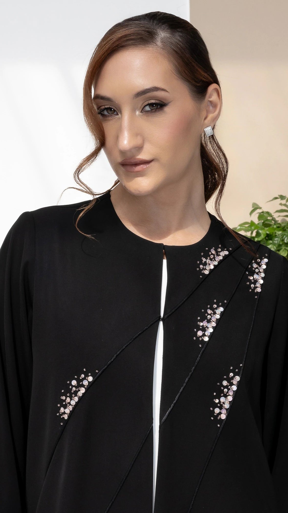 JAWA Noir Constelle Refined black Eid abaya with minimalist couture crystal detailing for elegant occasions