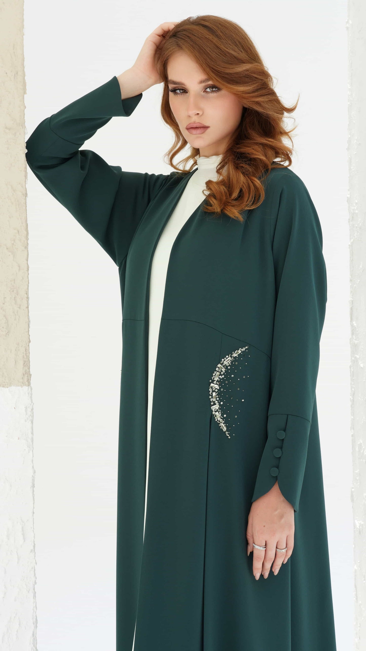 KAINA Emerald Éclat luxury emerald abaya flowing silhouette side view