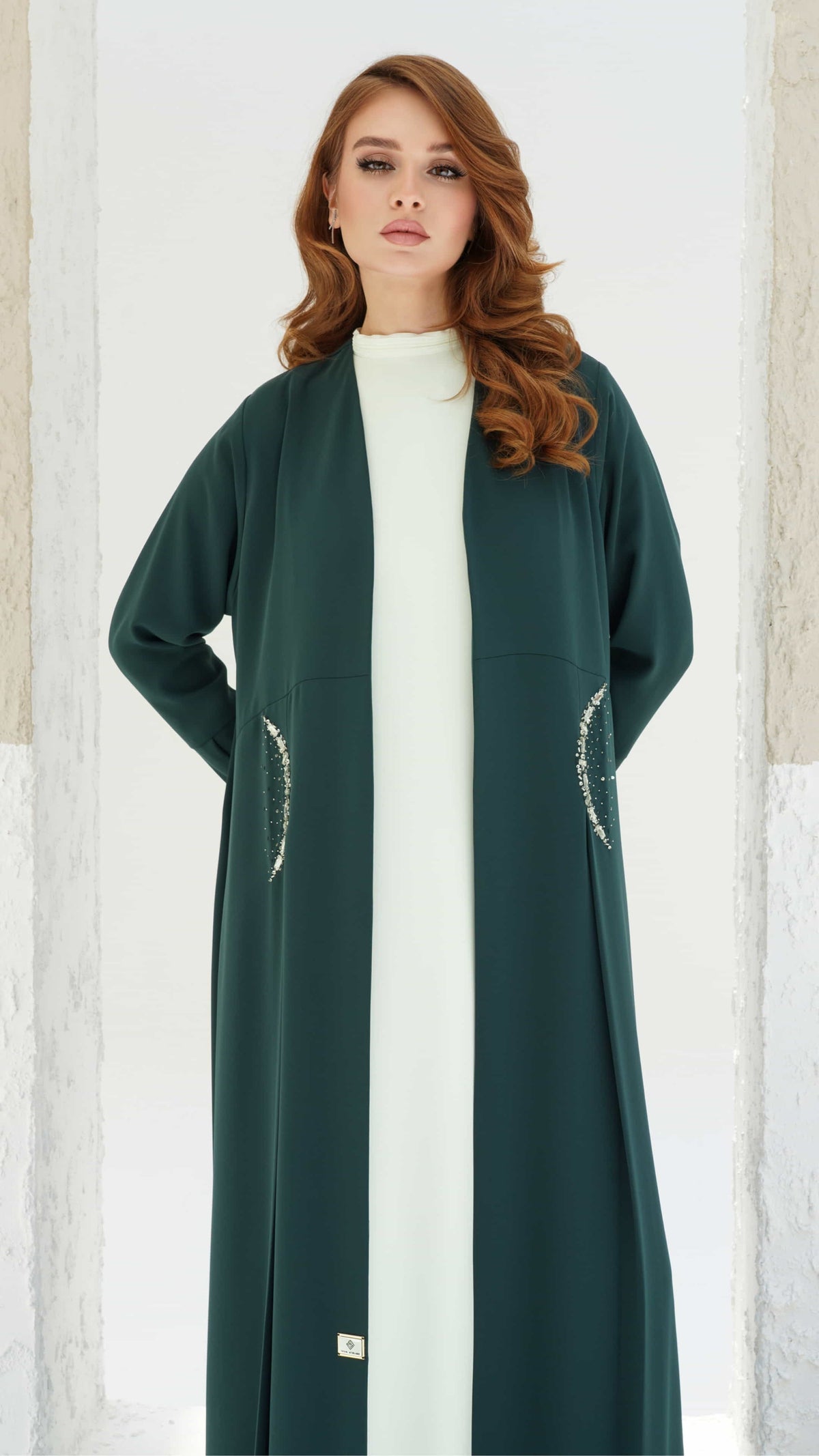 KAINA Emerald Éclat luxury emerald abaya flowing silhouette front view