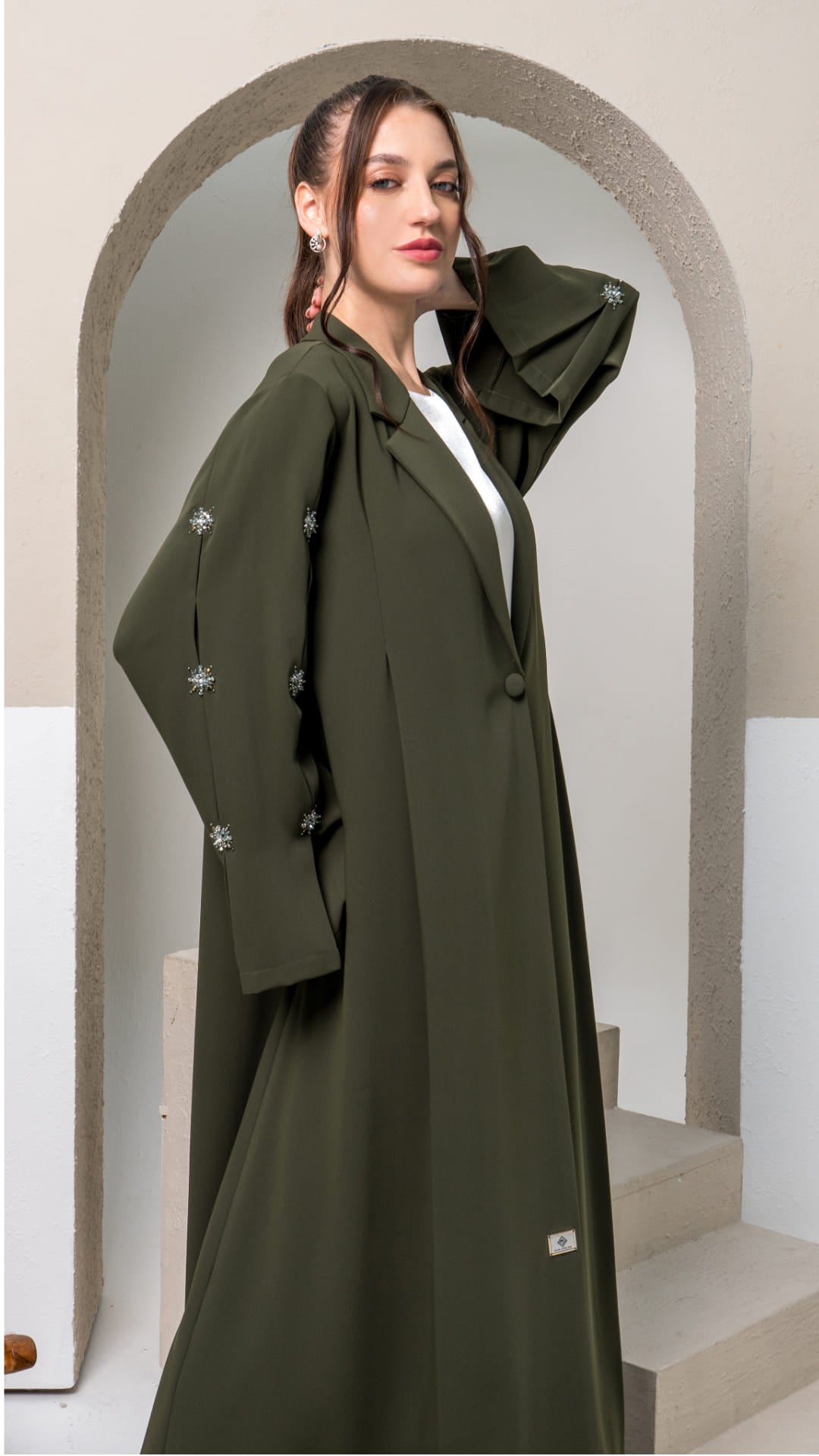 KAMILAH | Olivine Starfall Side pose Designer abaya with wide sleeves and refined detailing Diva Atelier