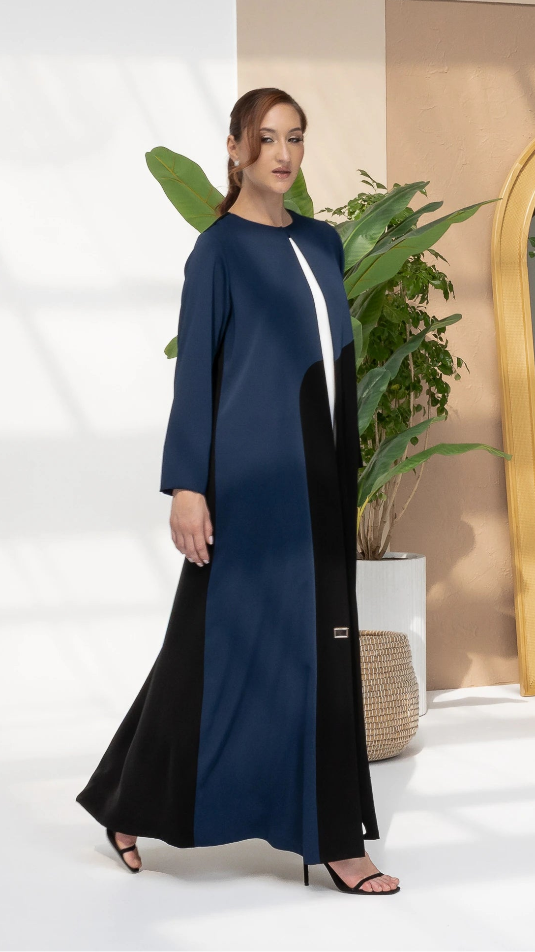 LAYZA | Obsidian Sapphire Abaya Refined modest fashion abaya with sculpted sapphire wave panel design