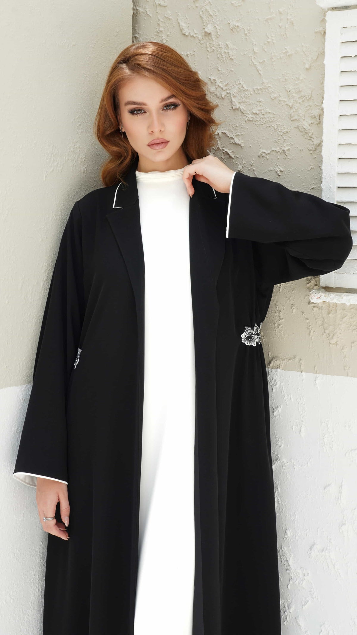 LOUNA | Parisian Noir Minimalist black abaya with subtle floral embroidery at the waist