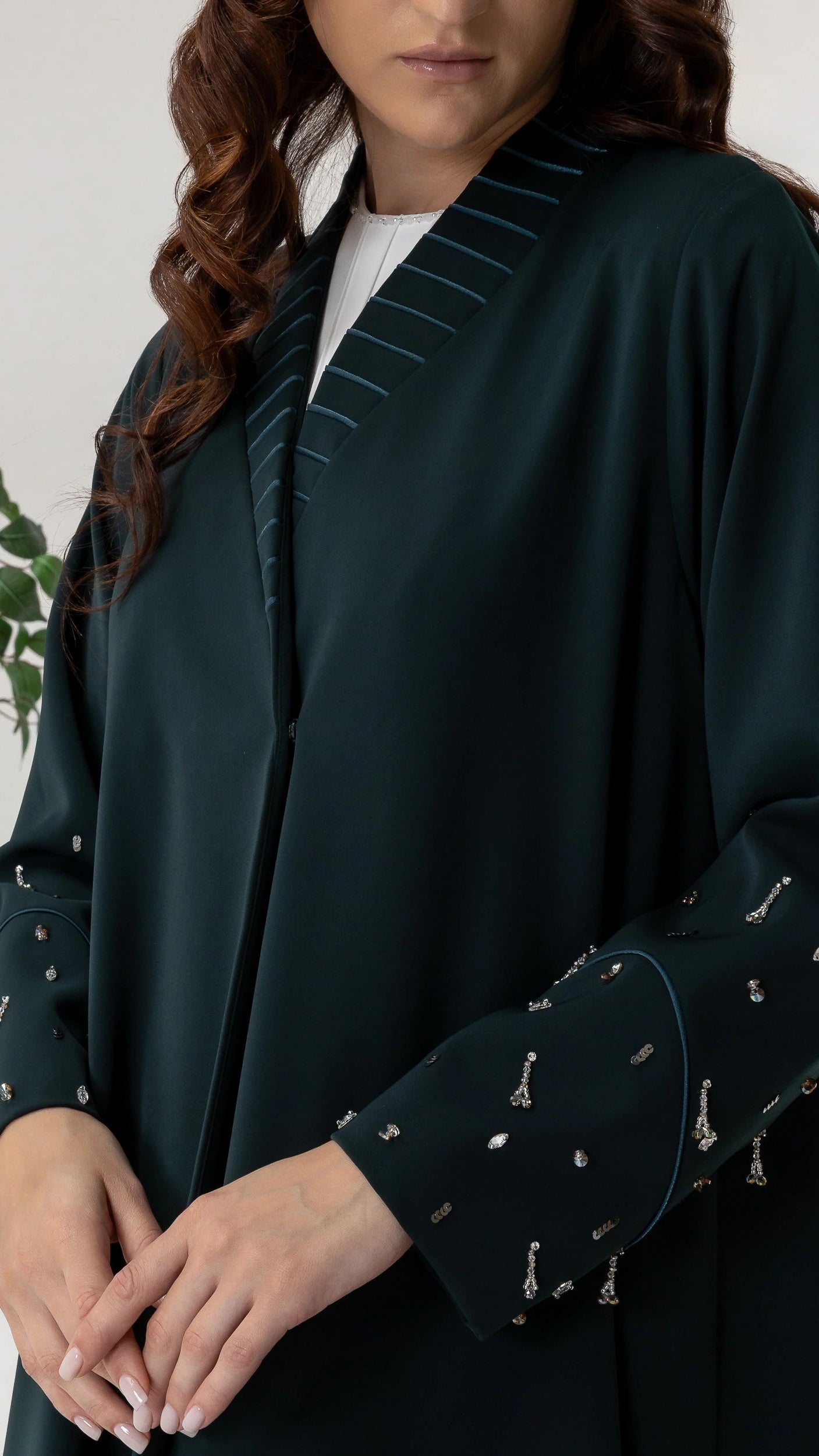 LYRA | Emerald Crystal Luxe Abaya Close-up portrait of emerald crystal luxury abaya with elegant shawl collar