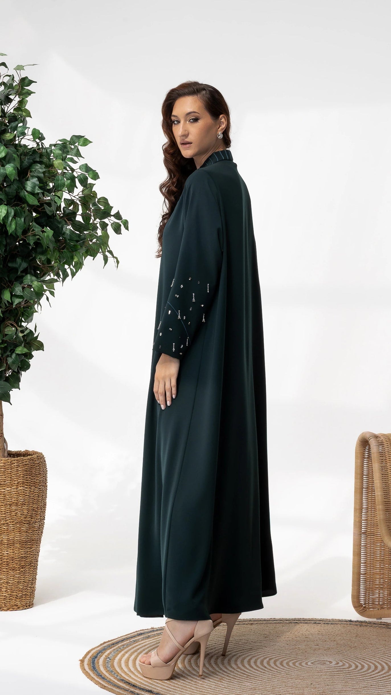 LYRA | Emerald Crystal Luxe Abaya Side profile of luxury emerald abaya with refined modestwear tailoring