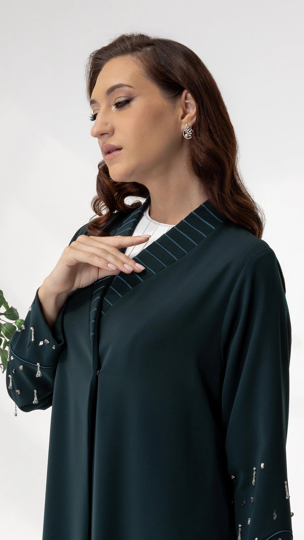 LYRA | Emerald Crystal Luxe Abaya Close-up detail of crystal embellished sleeves on emerald couture abaya