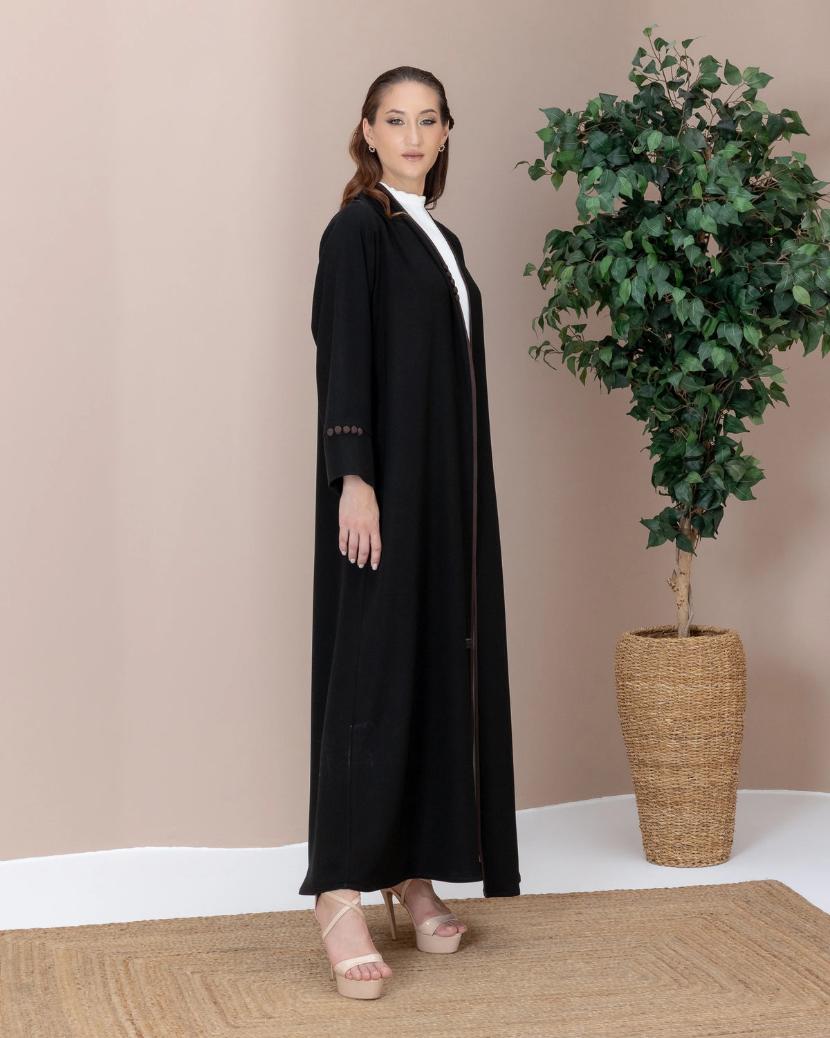 Leen Mocha Trim Abaya Side Pose highlighting structured cuffs and buttons