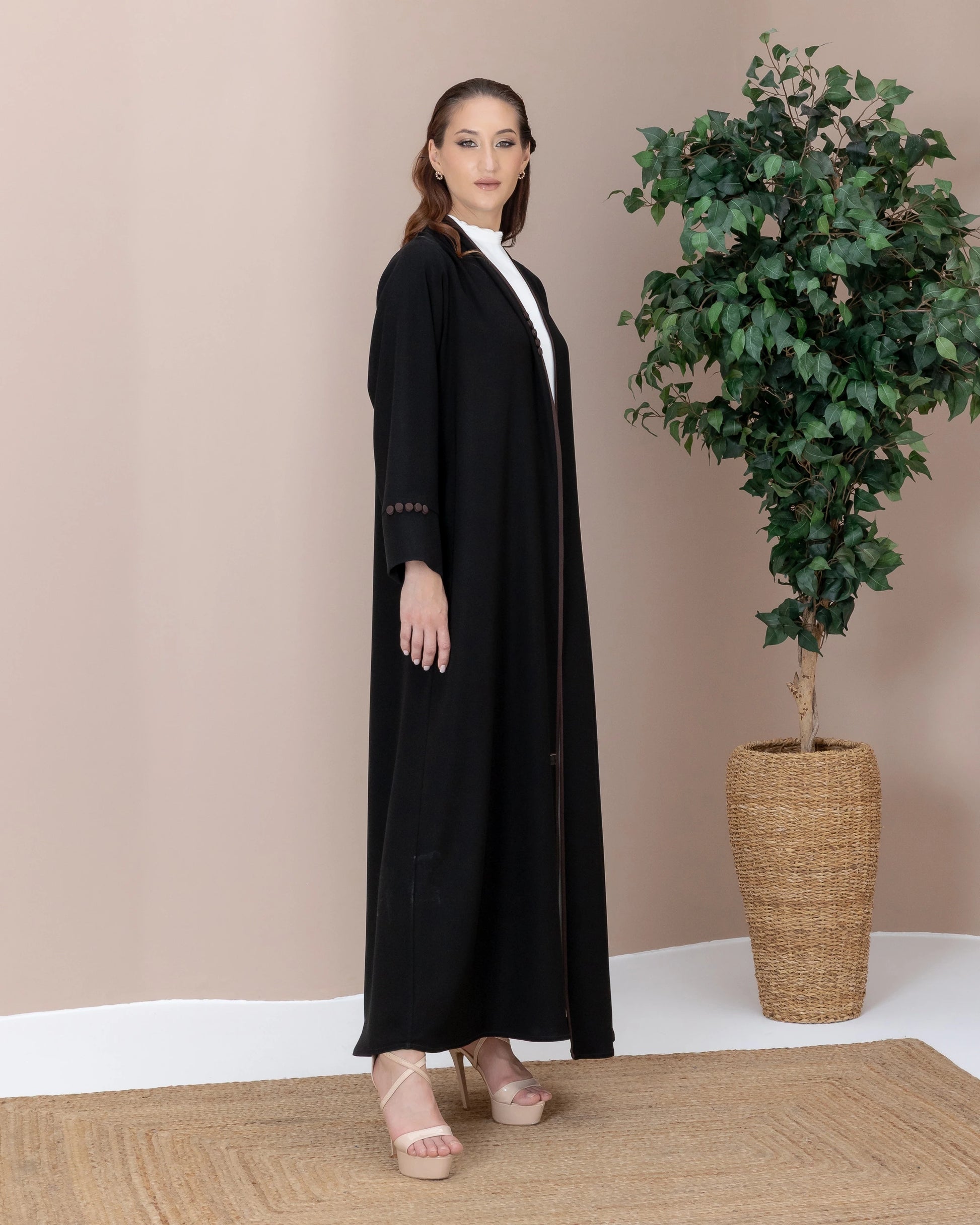 Leen Mocha Trim Abaya Side Pose highlighting structured cuffs and buttons
