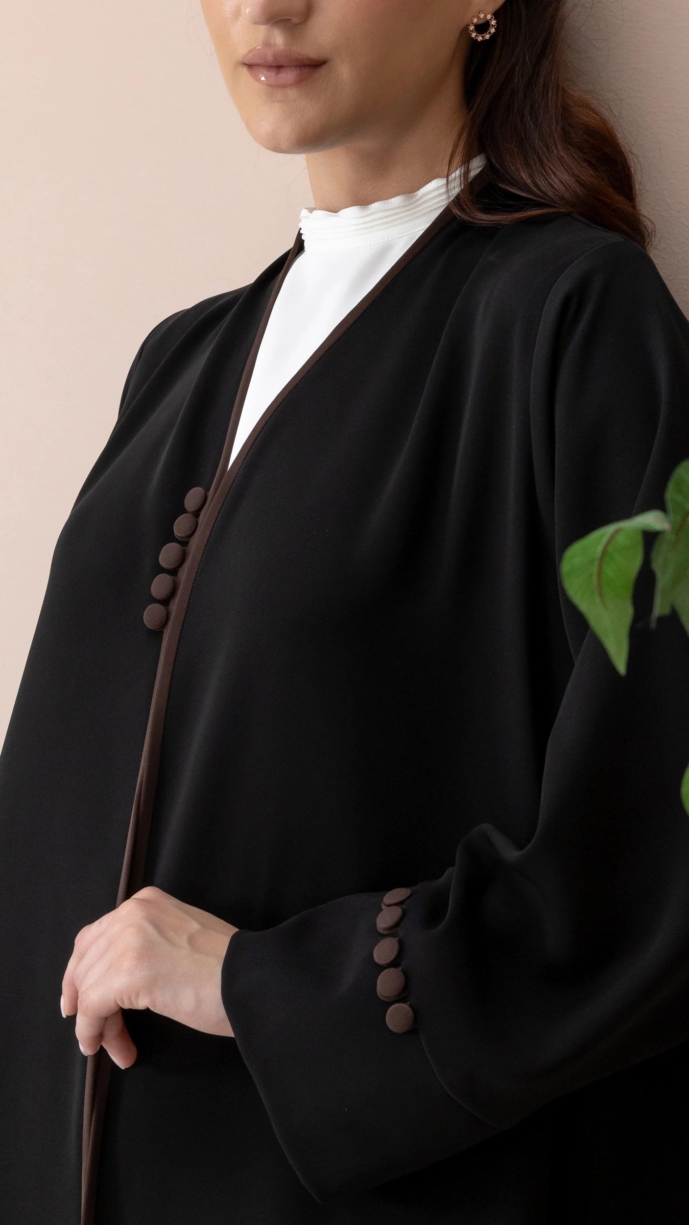 Leen abaya close up front buttons and chocolate piping detail