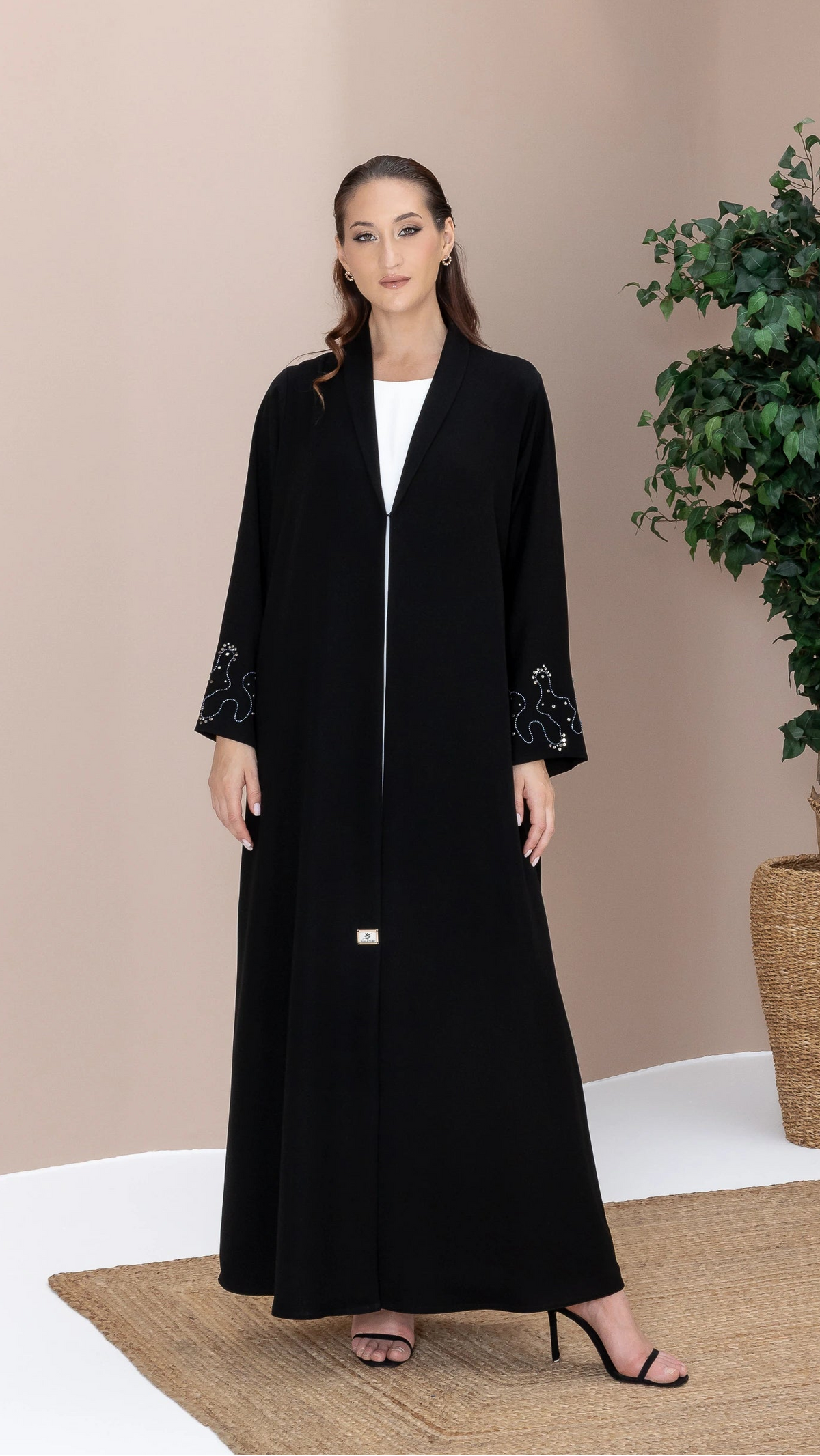 MAHREEN Noir Eclipse luxury black abaya with celestial crystal sleeve detailing and elegant flowing silhouette