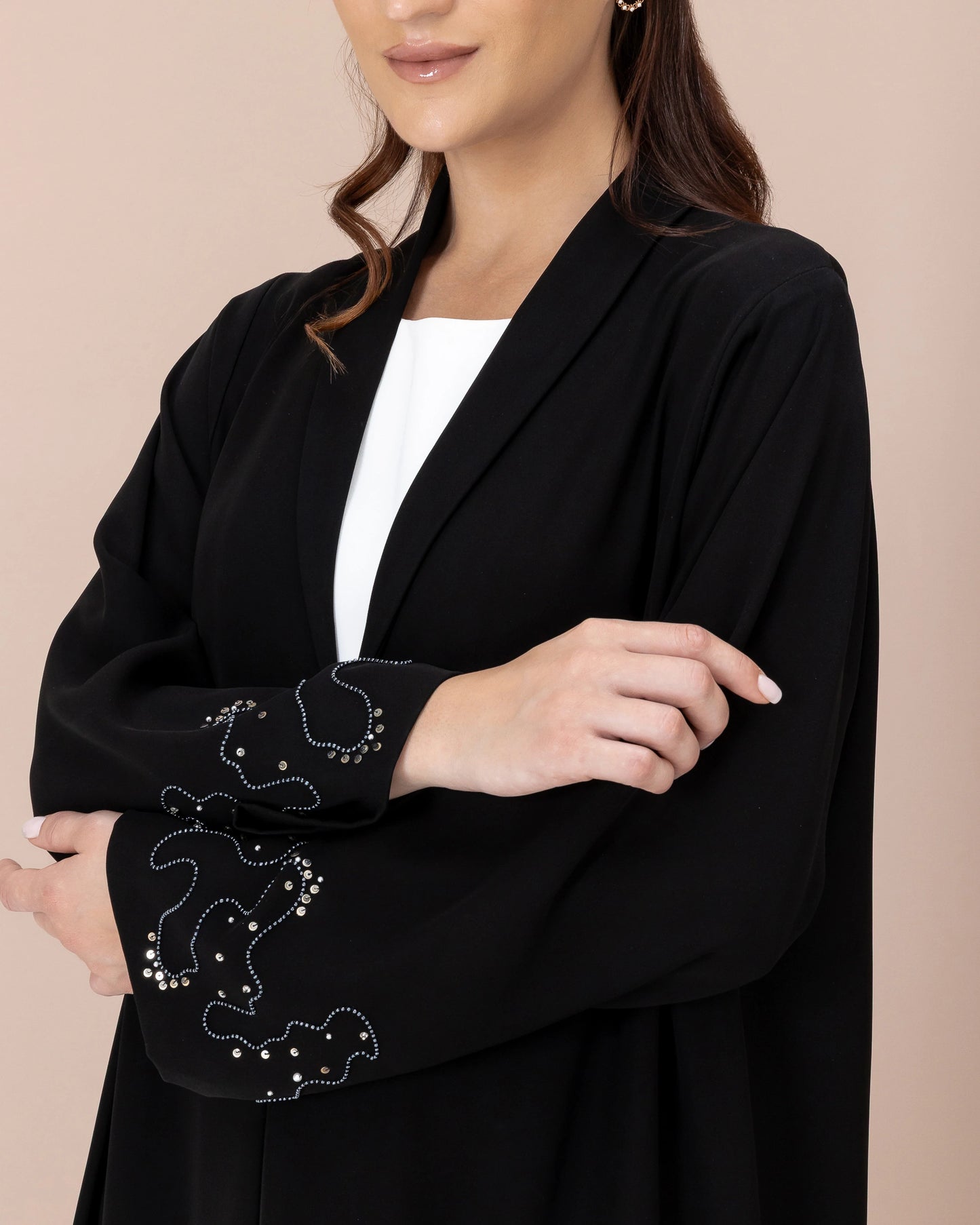 MAHREEN Noir Eclipse close-up of crystal sleeve artistry on premium luxury black abaya