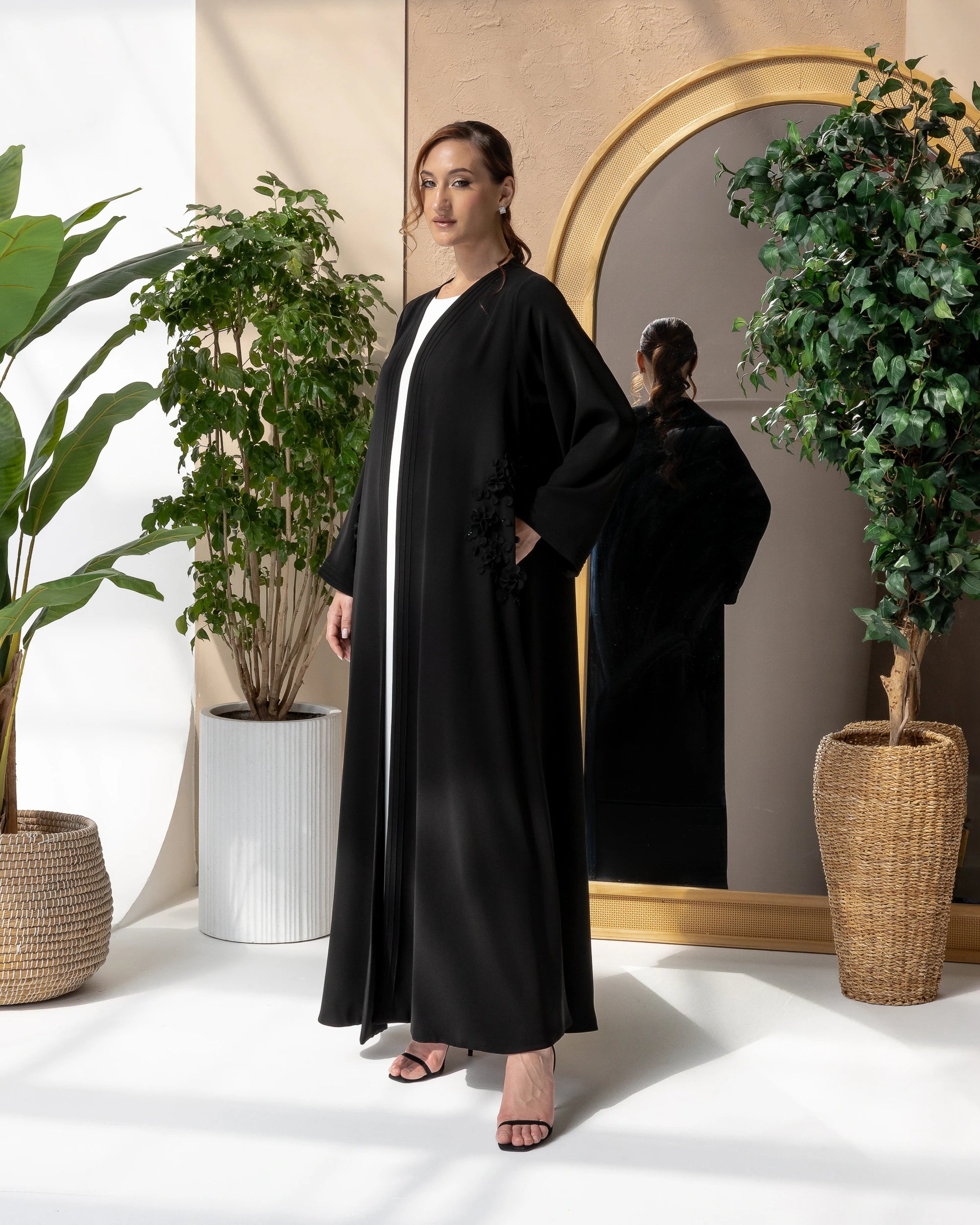MELINA Noir Blossom sophisticated black abaya designed for Ramadan, Eid, and elegant evening occasions