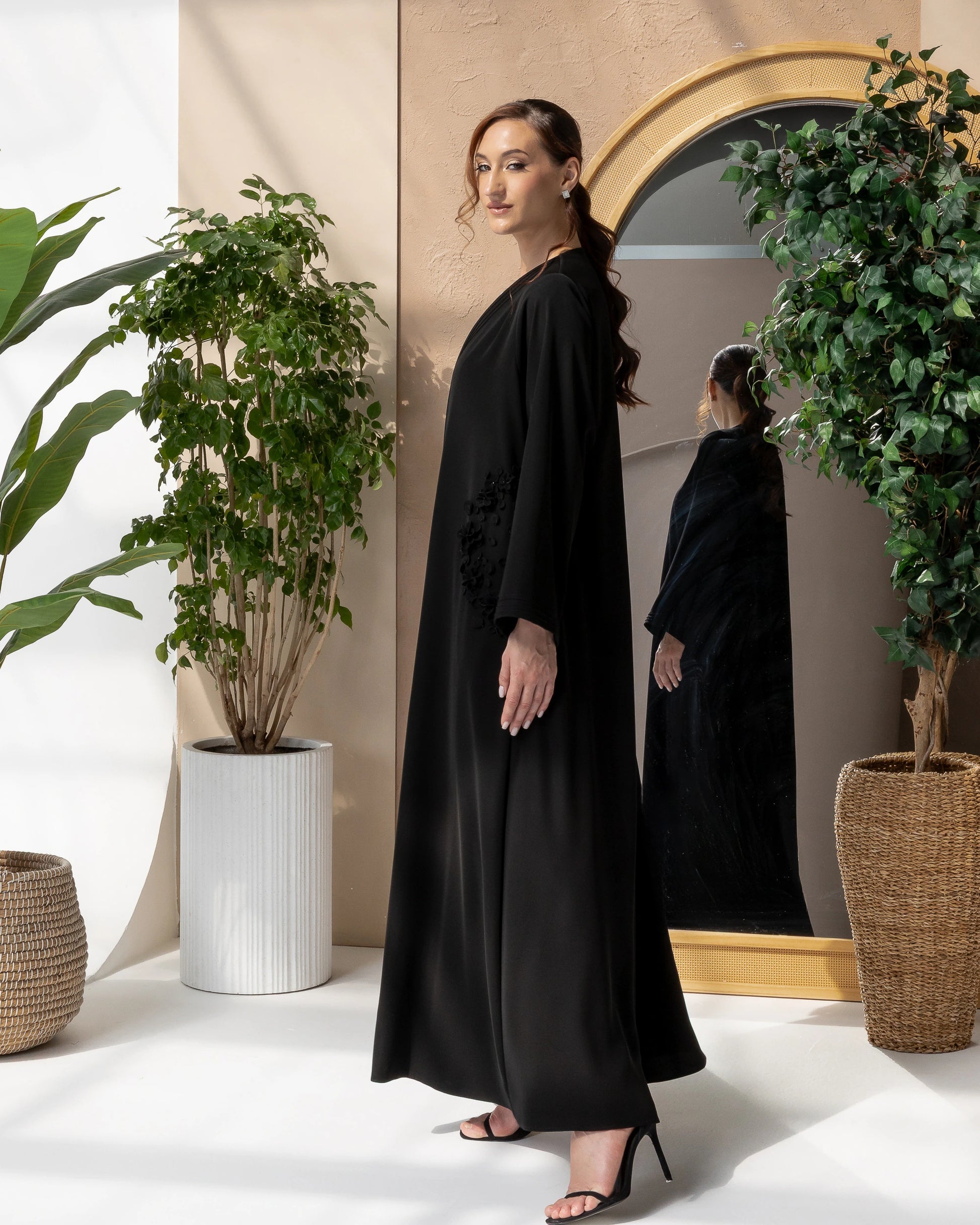 MELINA Noir Blossom side profile  of handcrafted black 3D floral embellishments on premium luxury abaya