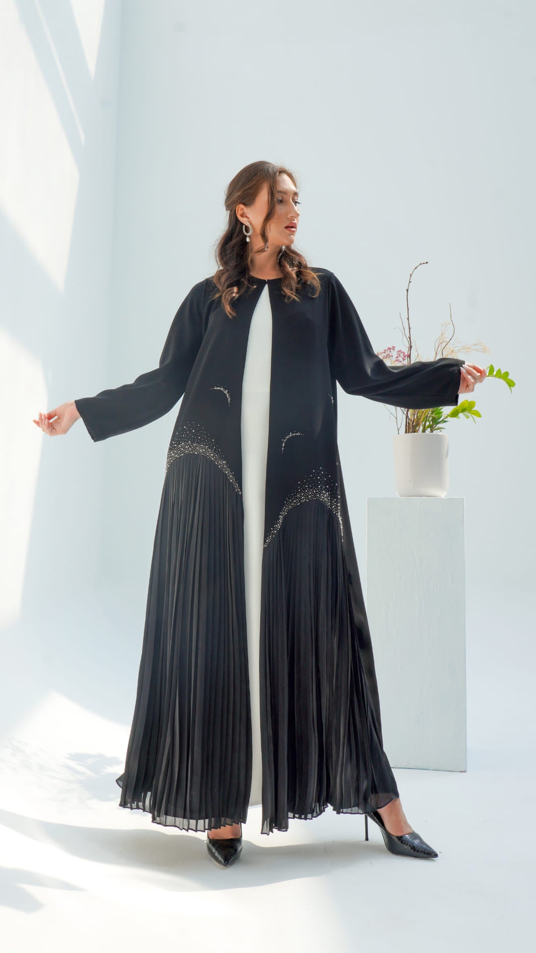 MIRA | Noir Diamond Luxe Black luxury abaya with pleated lower panel and contrast inner layer