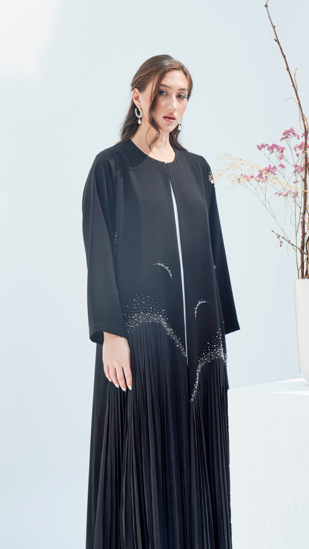 MIRA | Noir Diamond Luxe Side angle showing flowing silhouette of Mira Noir Diamond Luxe abaya