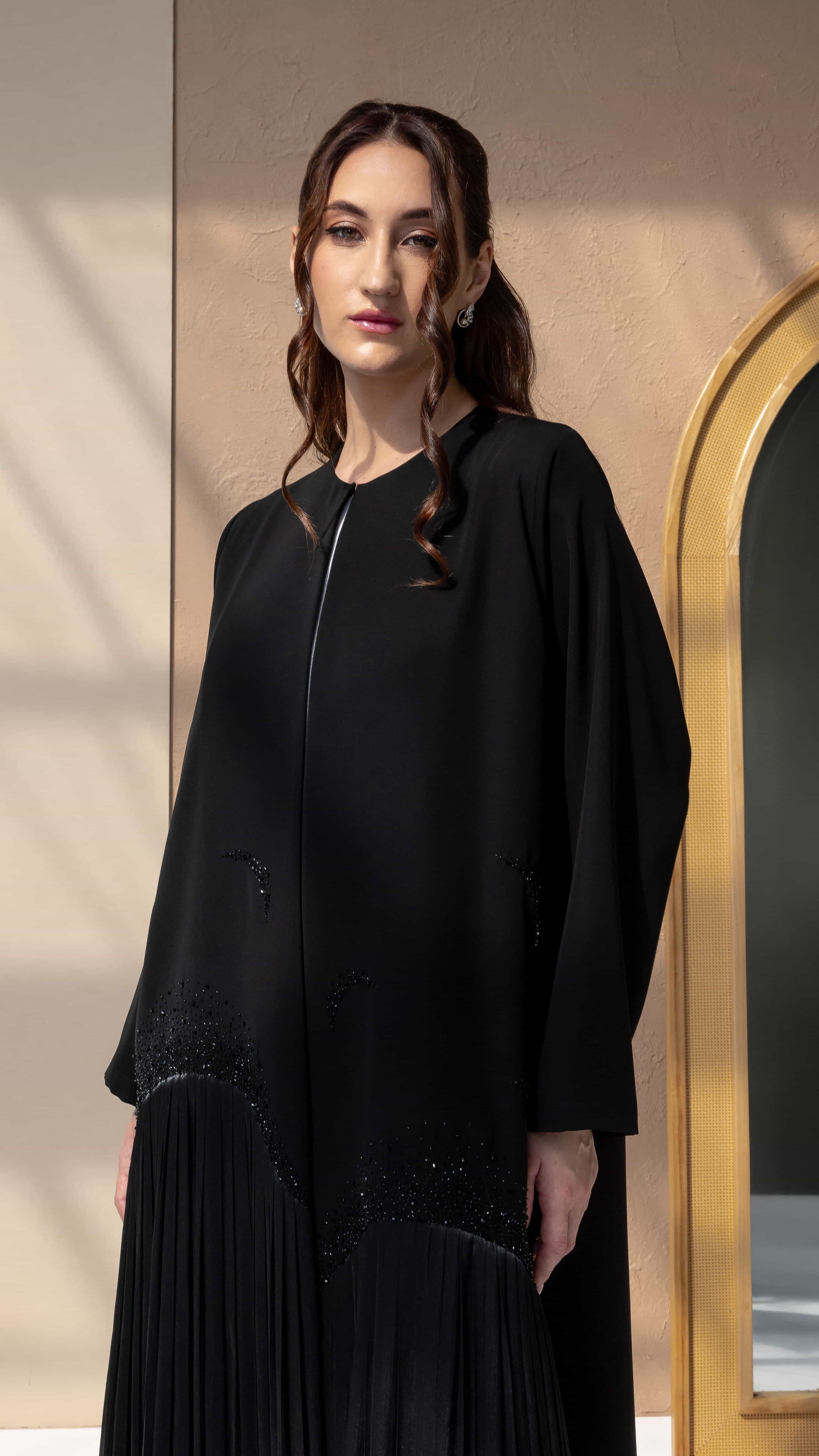 MIRA | Noir Shadow Luxe Pleated hem detail of Mira Noir Shadow Luxe luxury abaya in black