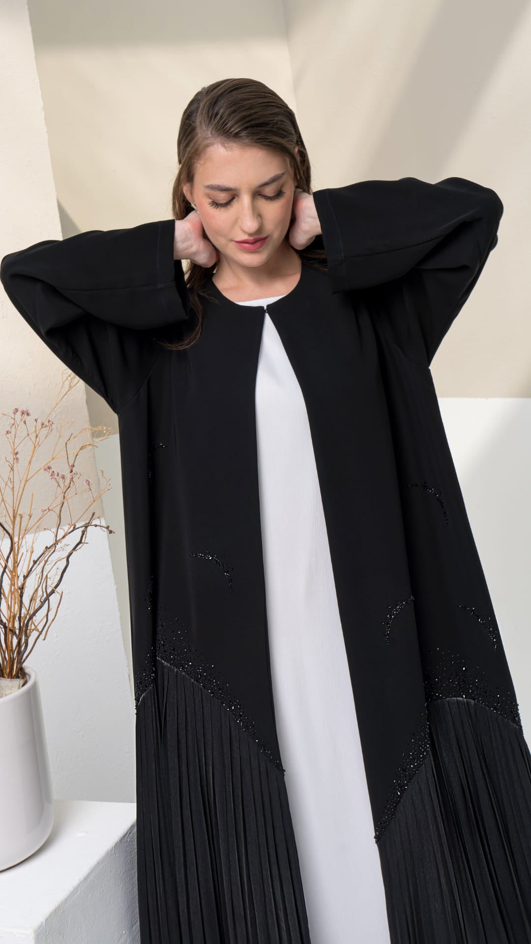 MIRA | Shadow Luxe 2.0 Black luxury abaya Mira Noir Shadow Luxe showing pleated lower panel movement