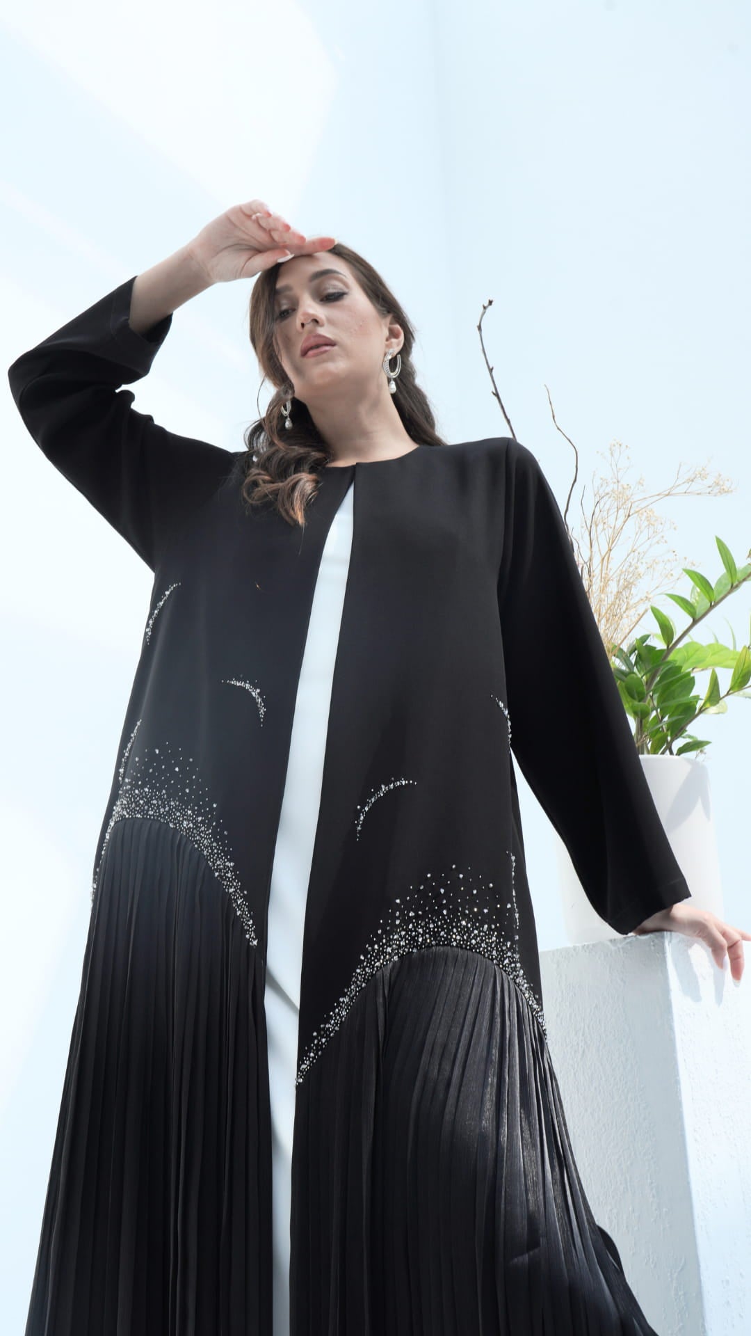 Close up of neckline to crystal pleats and embellishment detail on Mira Noir Diamond Luxe abaya