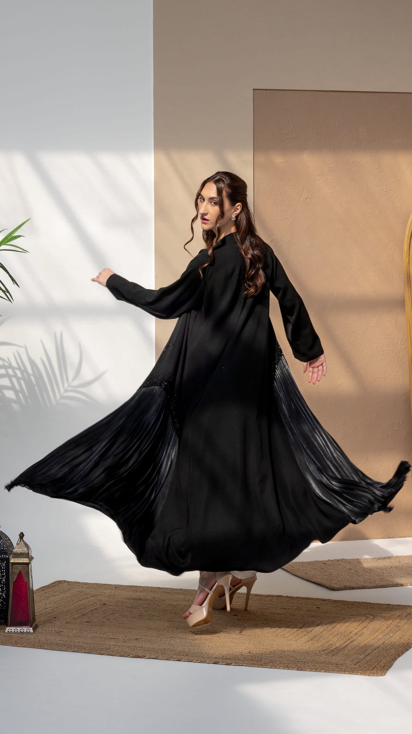 Mira Noir Shadow Luxe Movement capturing the drape and silhoutte and the contrastting pleat radiance