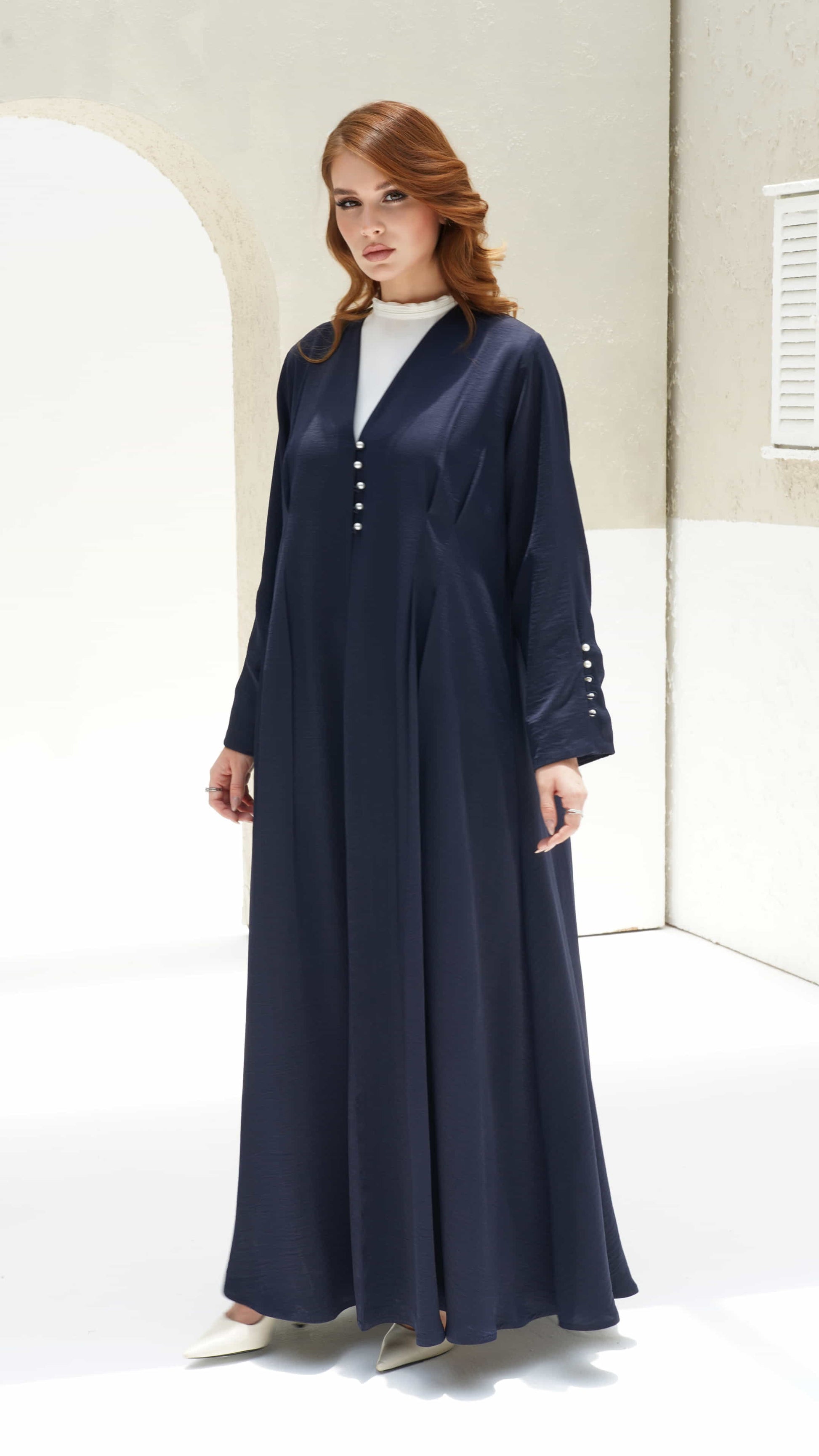 NAILA | Midnight Pearl Elegant midnight abaya with soft pleated flowing silhouette