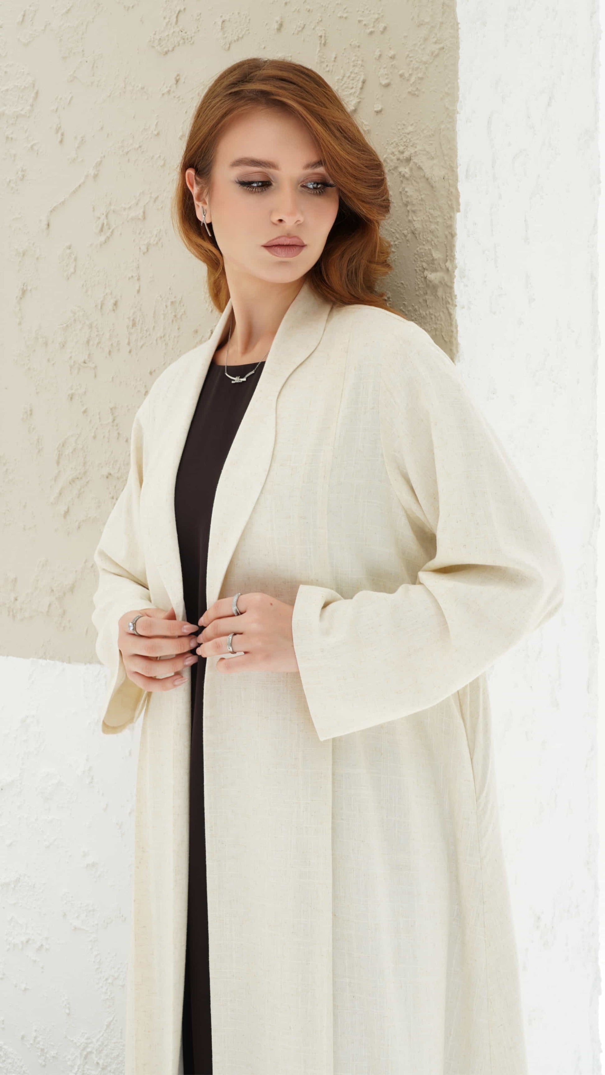 Naima ivory abaya with structured lapel and minimal luxury silhouette