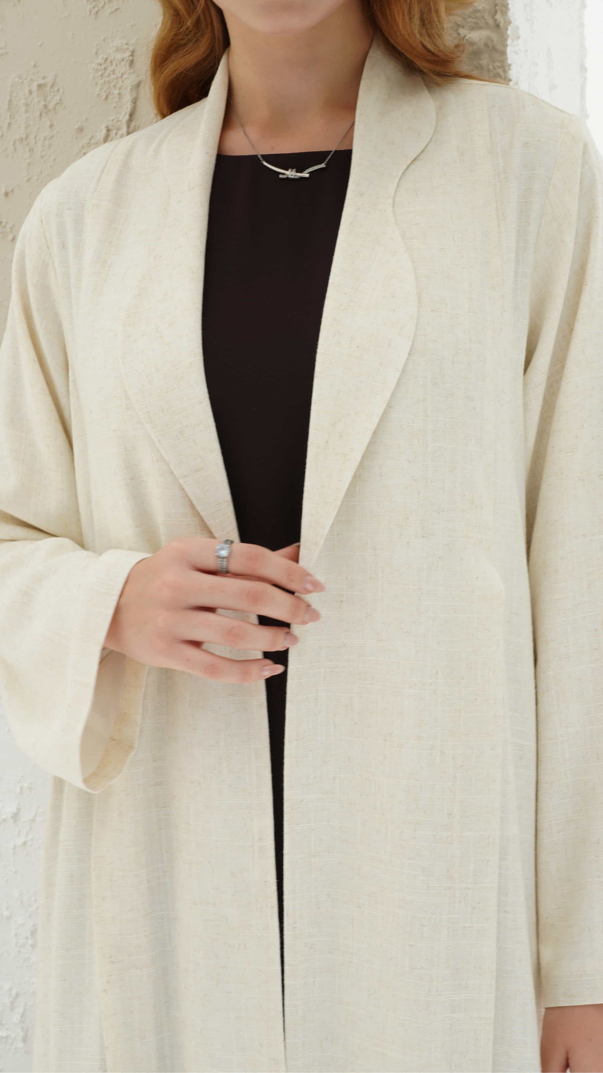 NAIMA | Ivory Elan Minimal ivory abaya styled with inner dress for luxury look