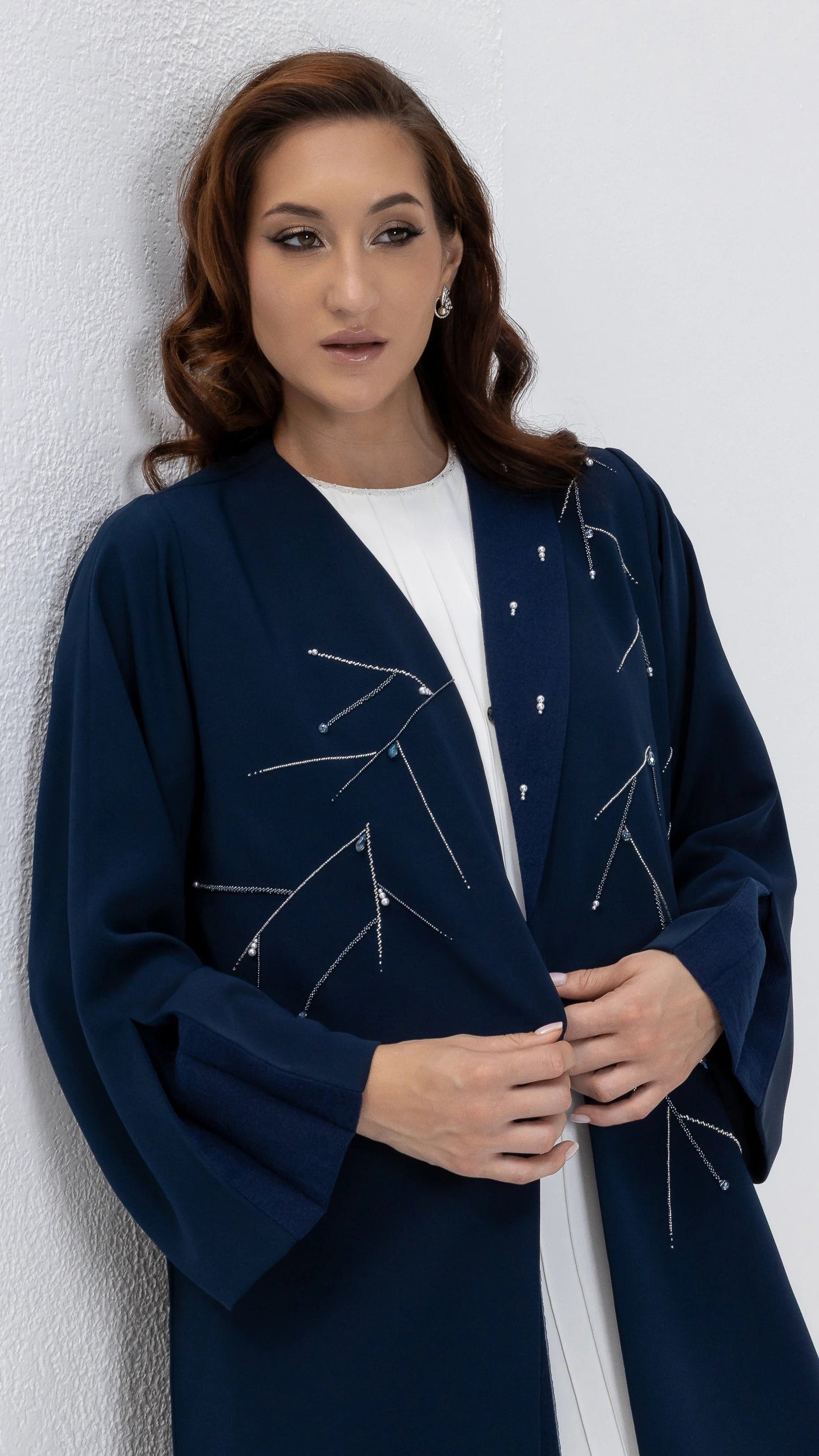 NAYRA | Twilight Luxe Abaya Luxury modestwear abaya sleeve flare detailing in deep blue with refined crystal accents