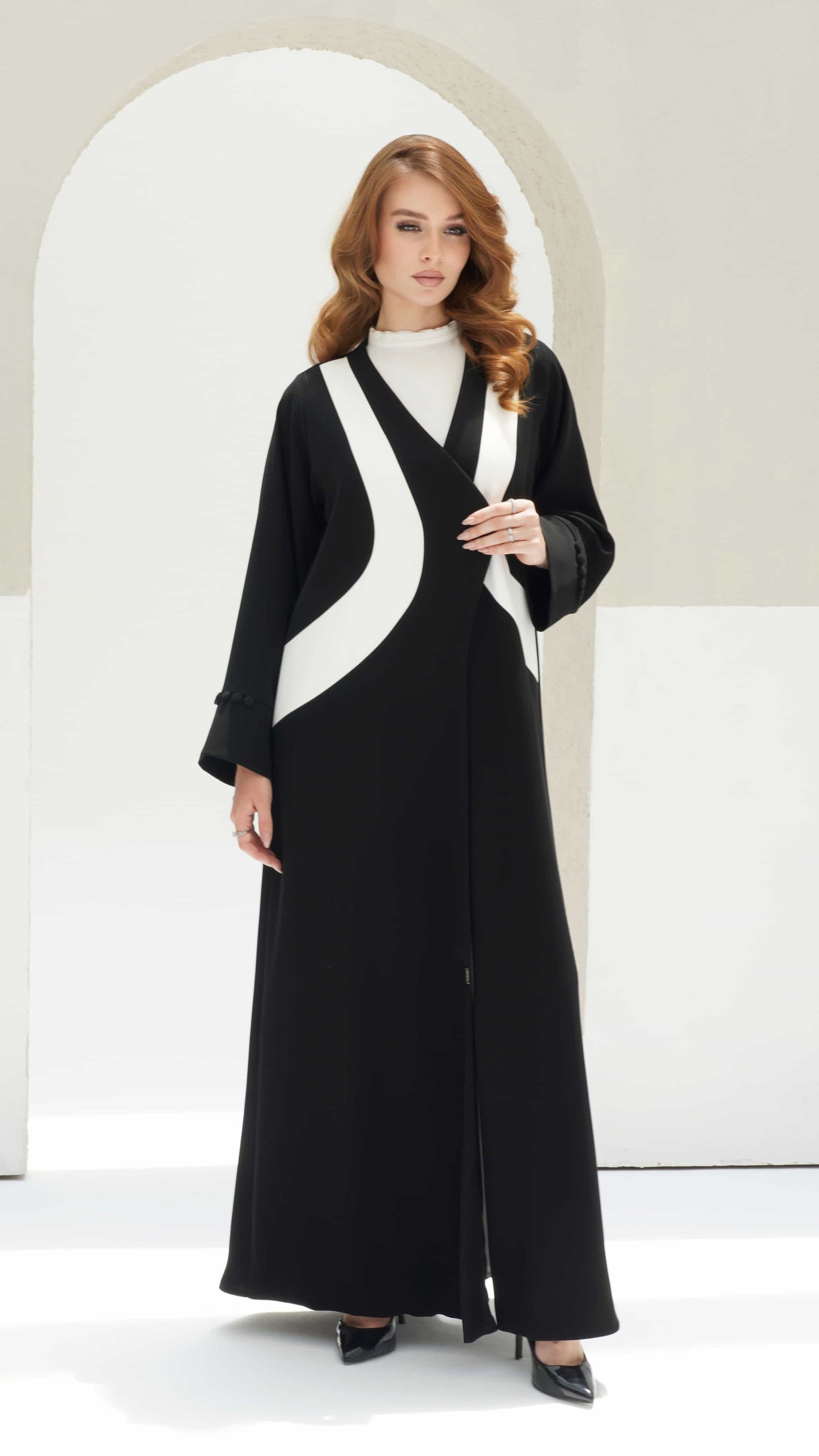 NOURINE | Noir Muse Elegant monochrome abaya with flowing silhouette and structured overlap design
