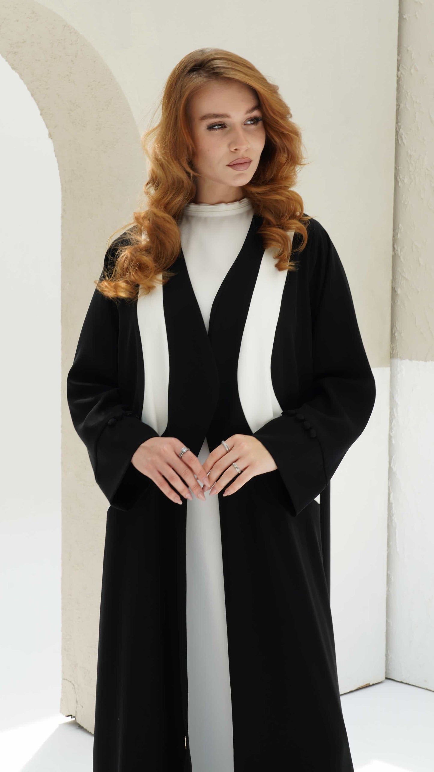 NOURINE | Noir Muse Close up of ivory contrast panel detailing on black abaya