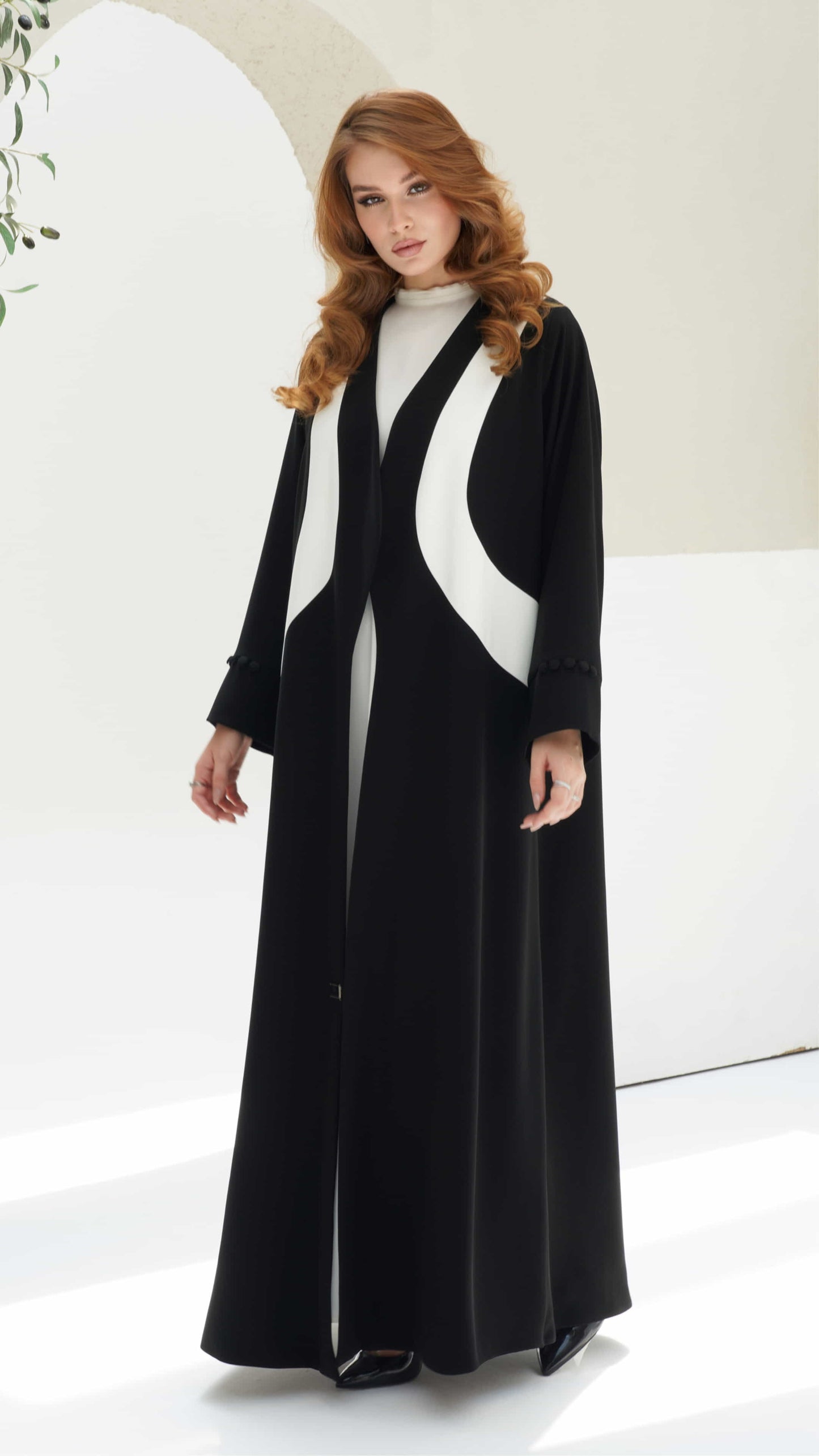 NOURINE | Noir Muse Contemporary modest fashion abaya with bold monochrome styling
