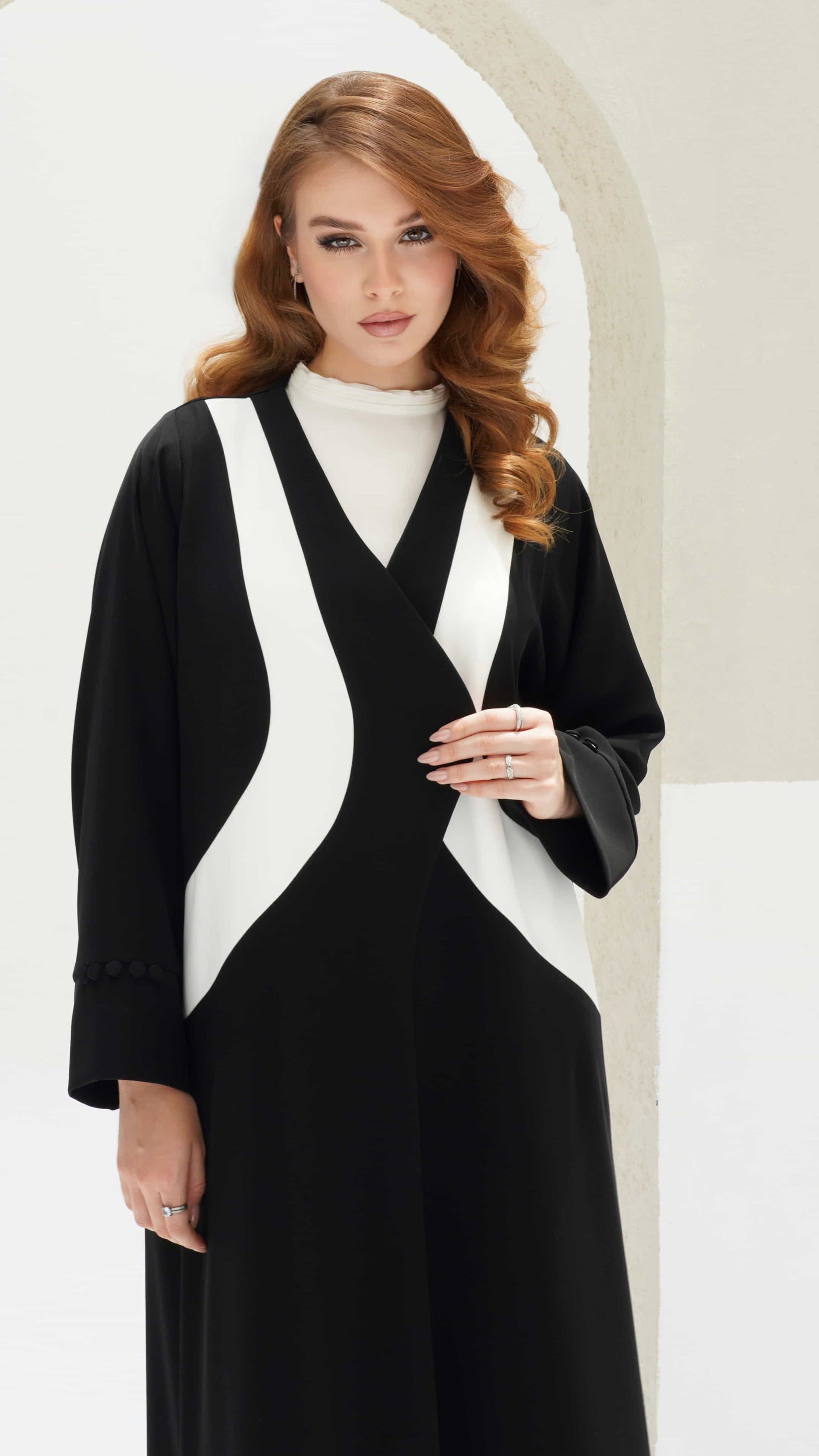NOURINE | Noir Muse Luxury black abaya with ivory curves and refined elegant structure
