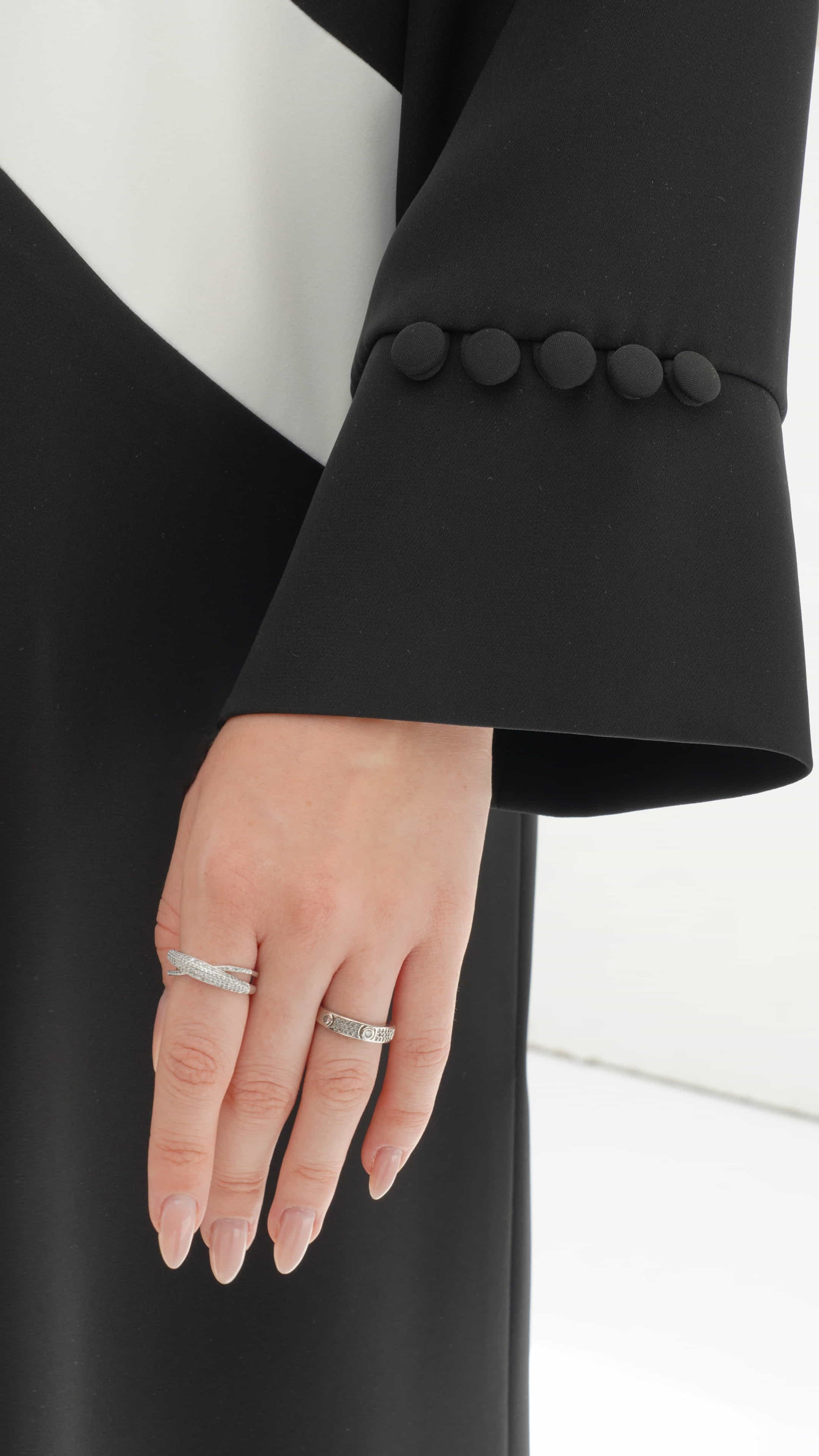 NOURINE | Noir Muse Sleeve detail with button accents on minimalist noir abaya