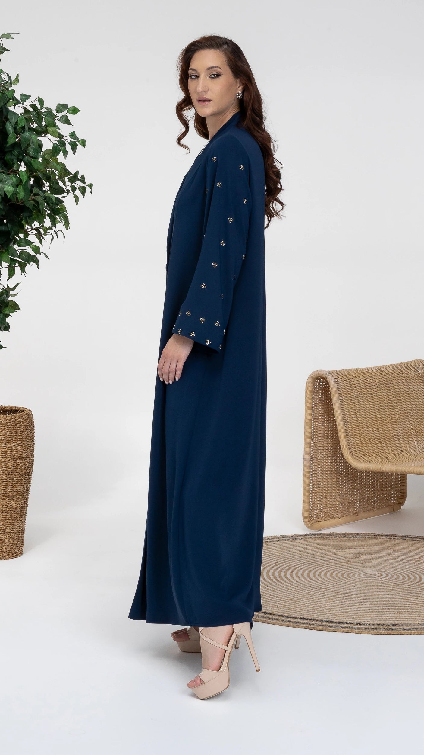 NUJUMA Midnight Luxe side profile showcasing flowing luxury silhouette and embellished sleeves